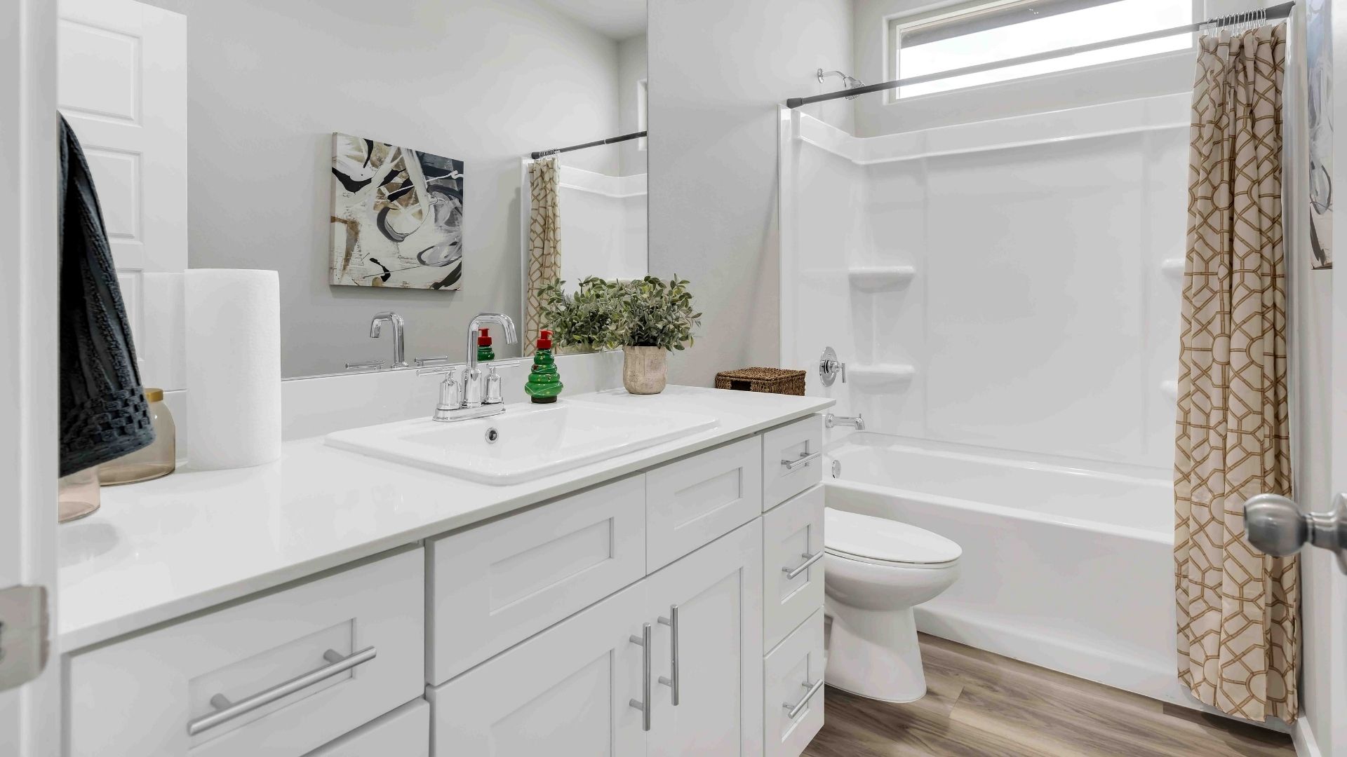 Guest bathroom with built in vanity and combination bathtub shower