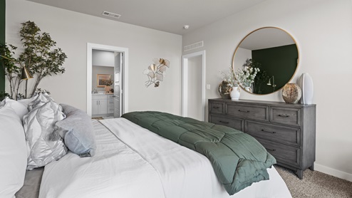 Adjacent view of primary bedroom with attached bathroom