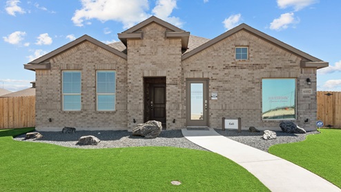 Exterior of single-story Cali floor plan timeless brick home with spacious front walkway