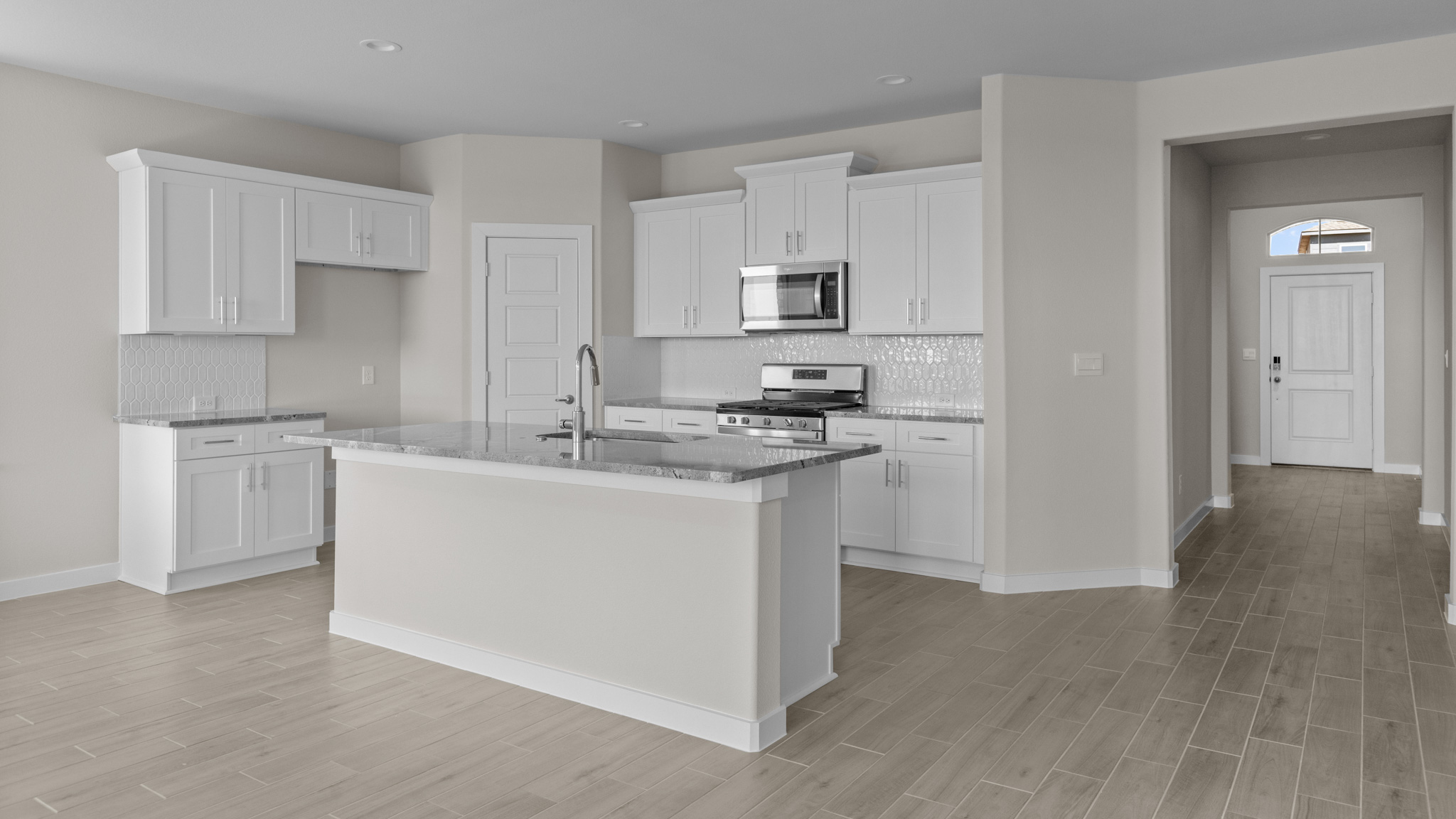 White kitchen with oversized kitchen island