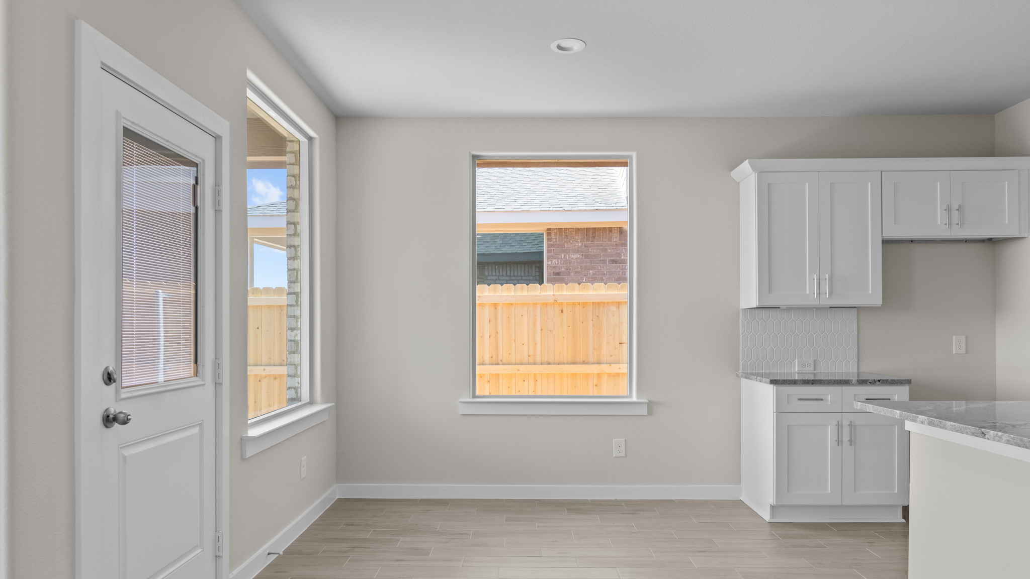 Open concept dining nook next to kitchen