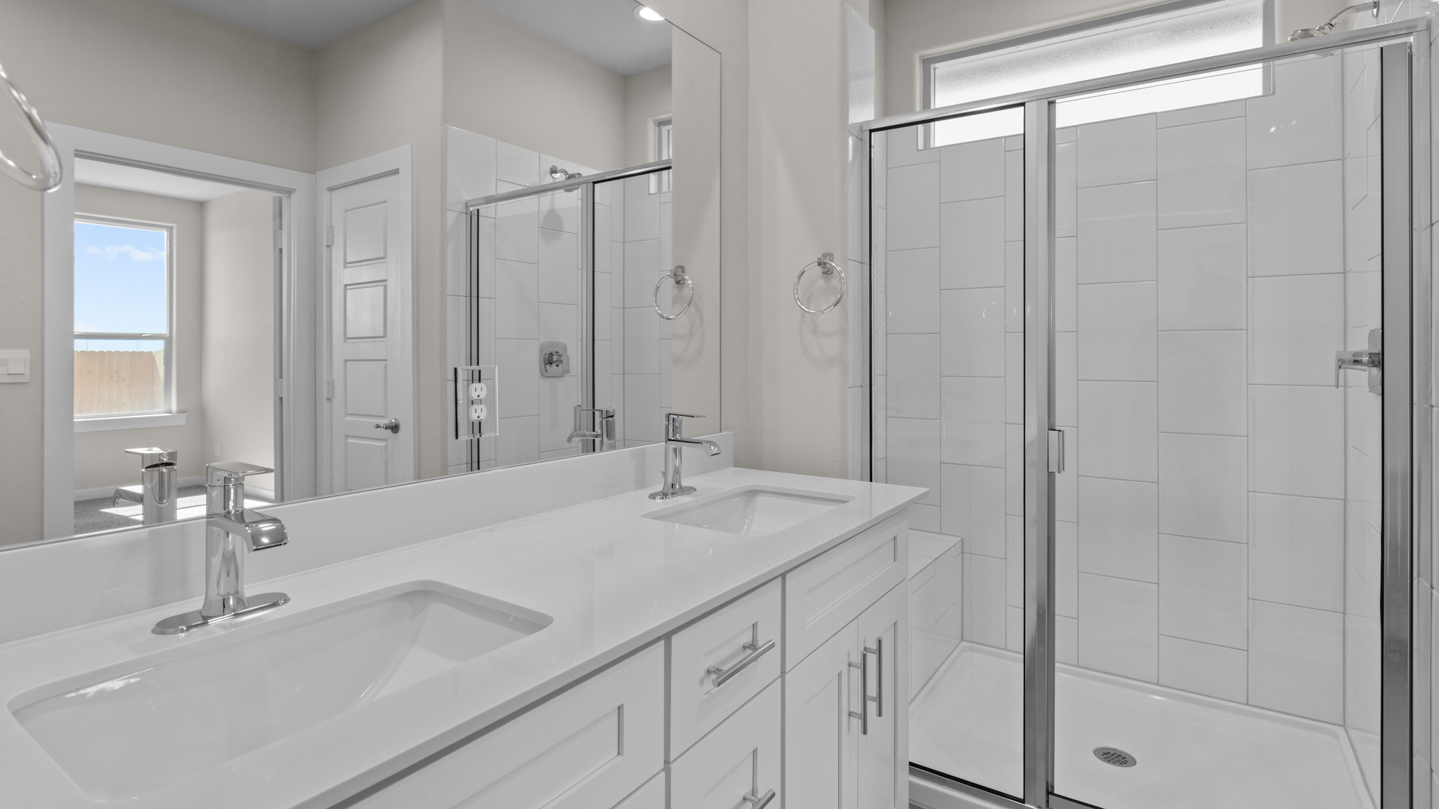 Primary bathroom cultured marble vanity tops and walk-in shower