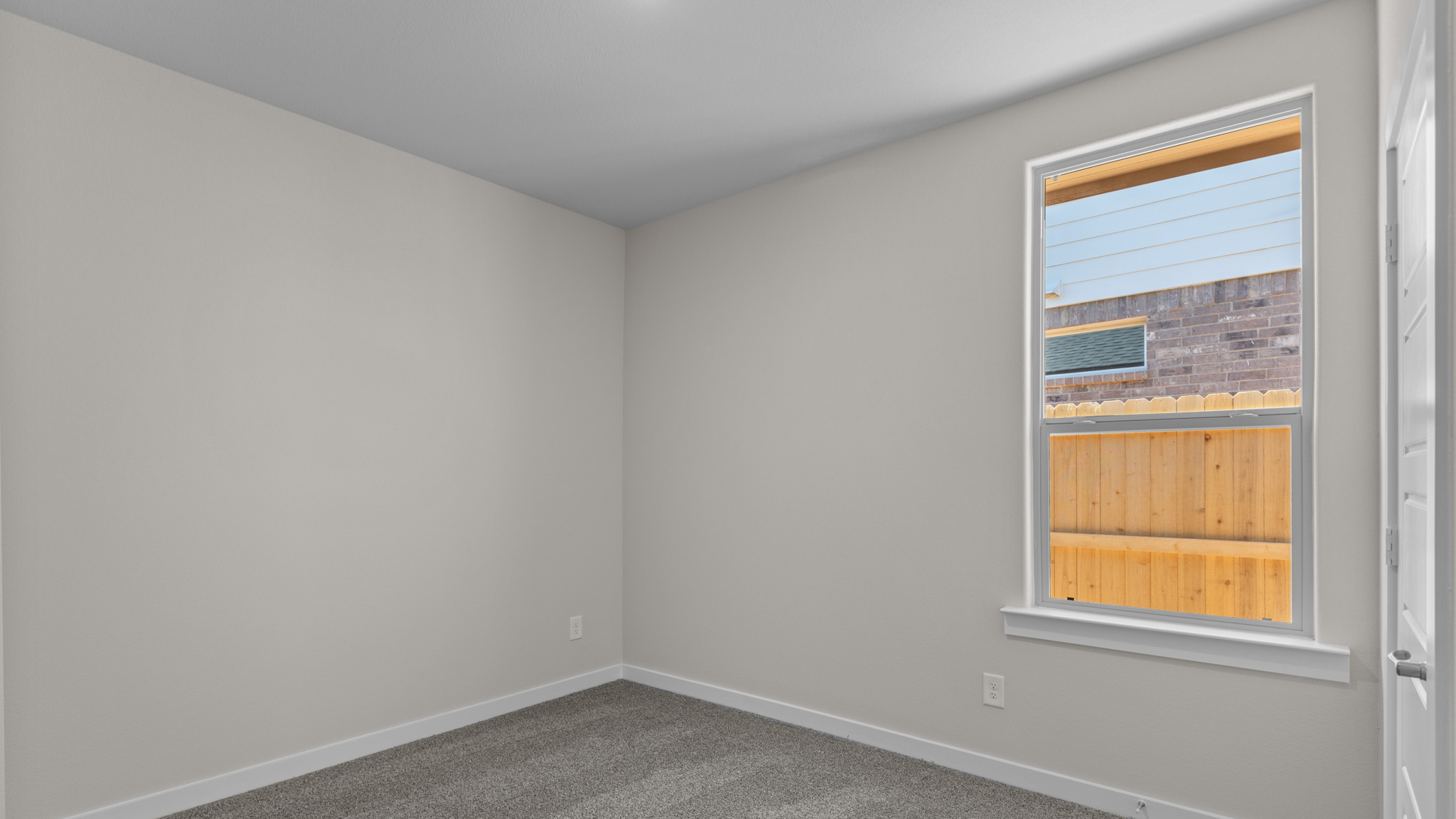 Guest bedroom two with plush carpet floors