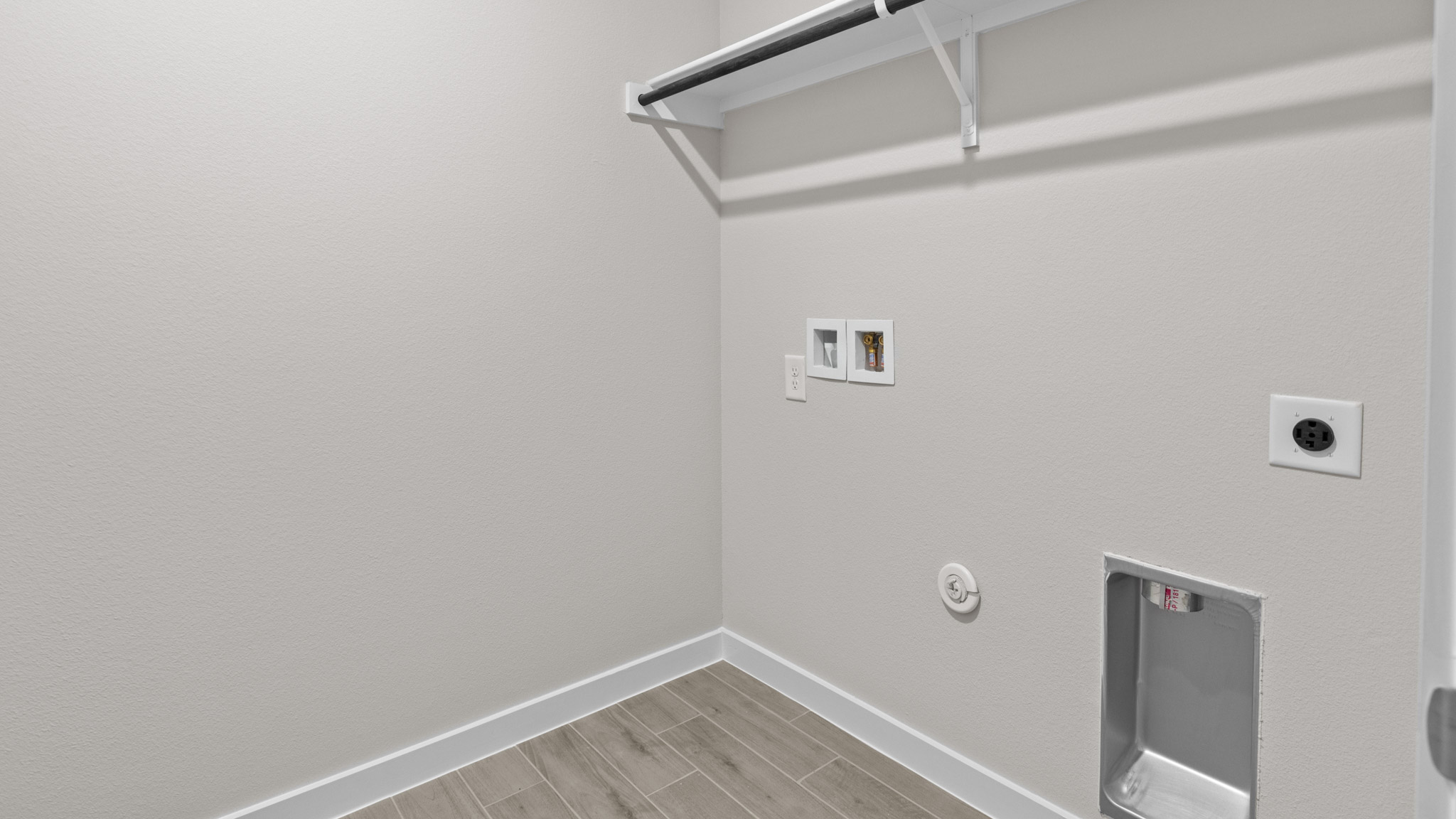 Laundry room and utility area with additional shelving