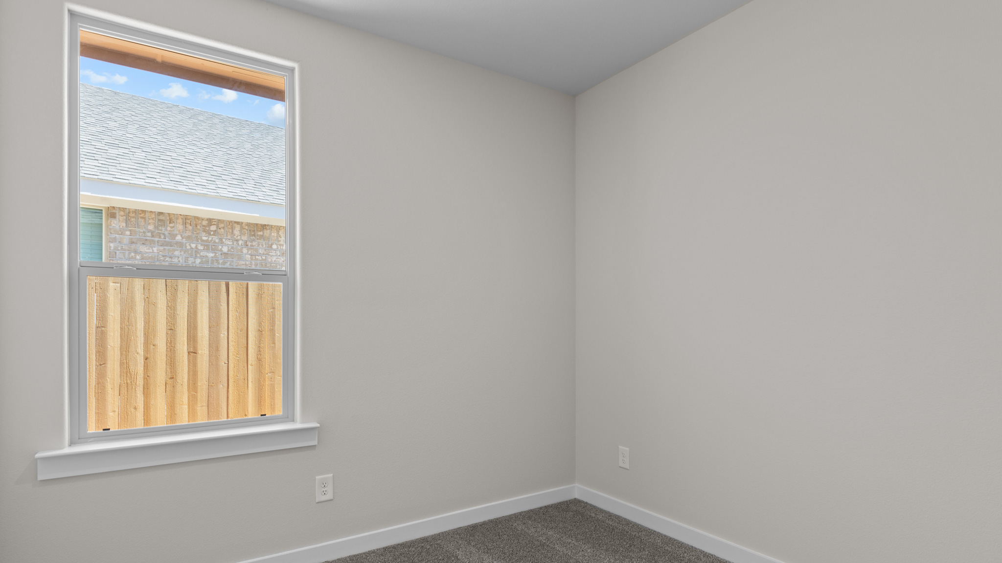 Guest bedroom three with carpeted floors
