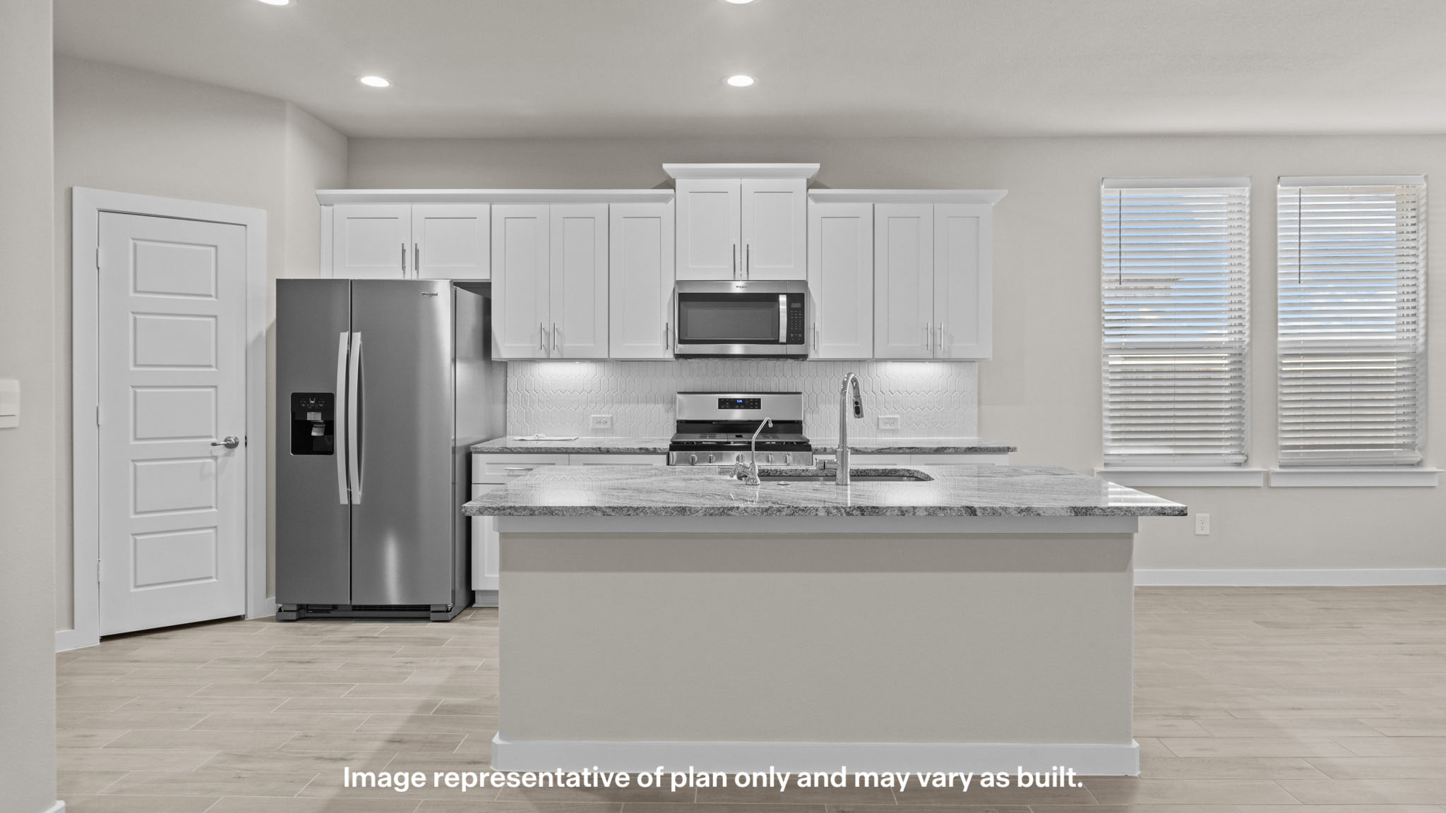 Spacious open concept kitchen with island and counter prep space