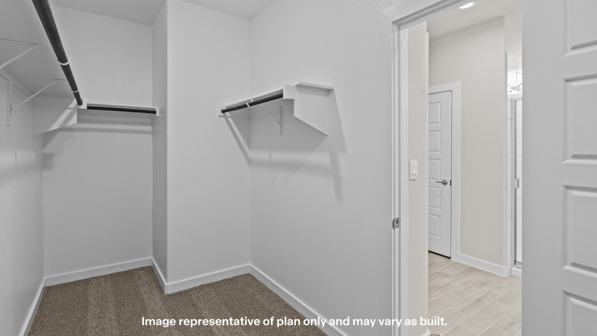 Primary walk-in closet with extra storage space