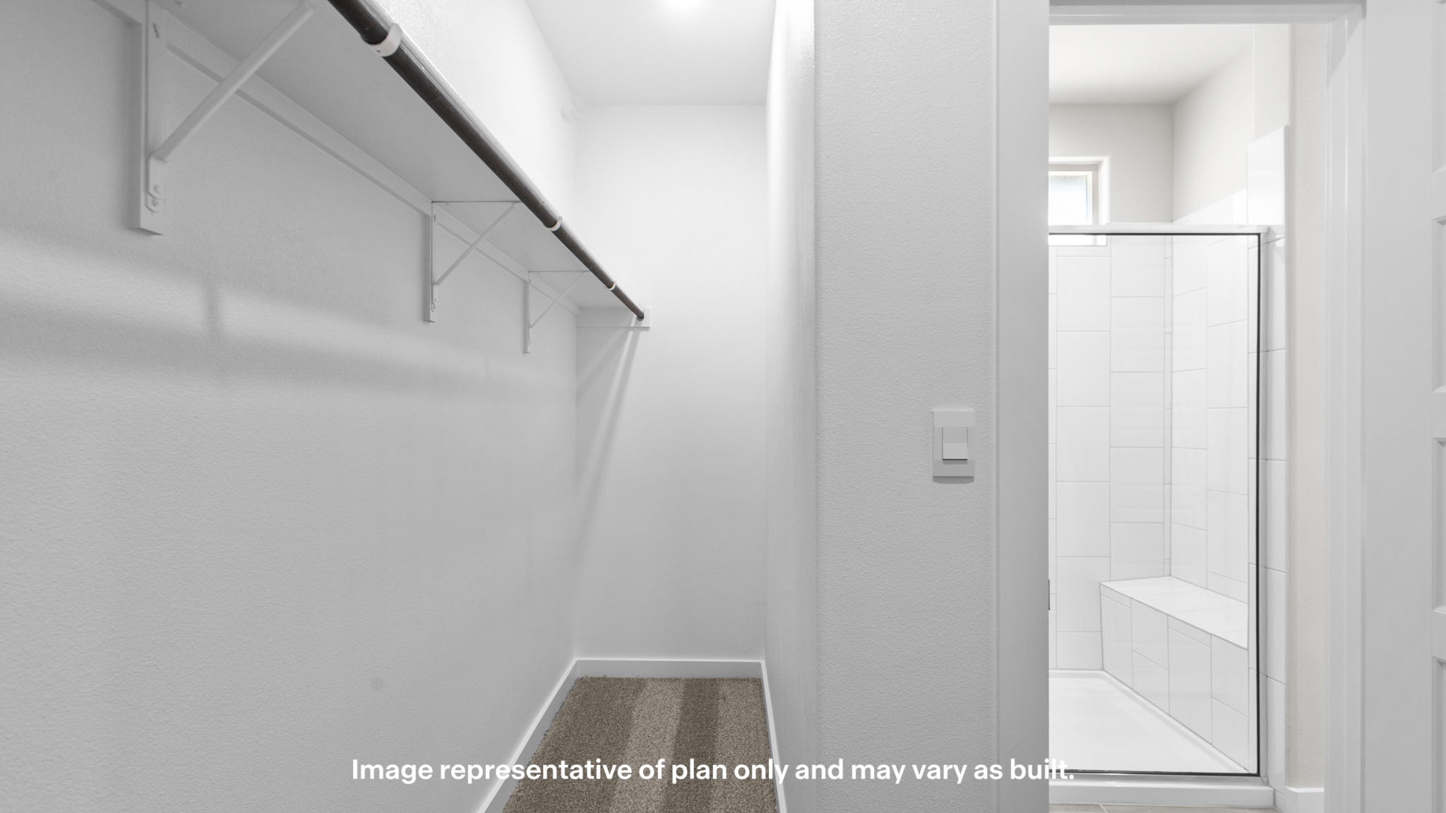 Private primary walk-in closet with extra storage space