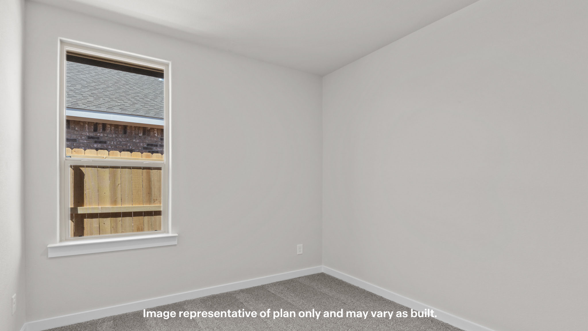 Guest bedroom 2 with side window and plush carpet floor