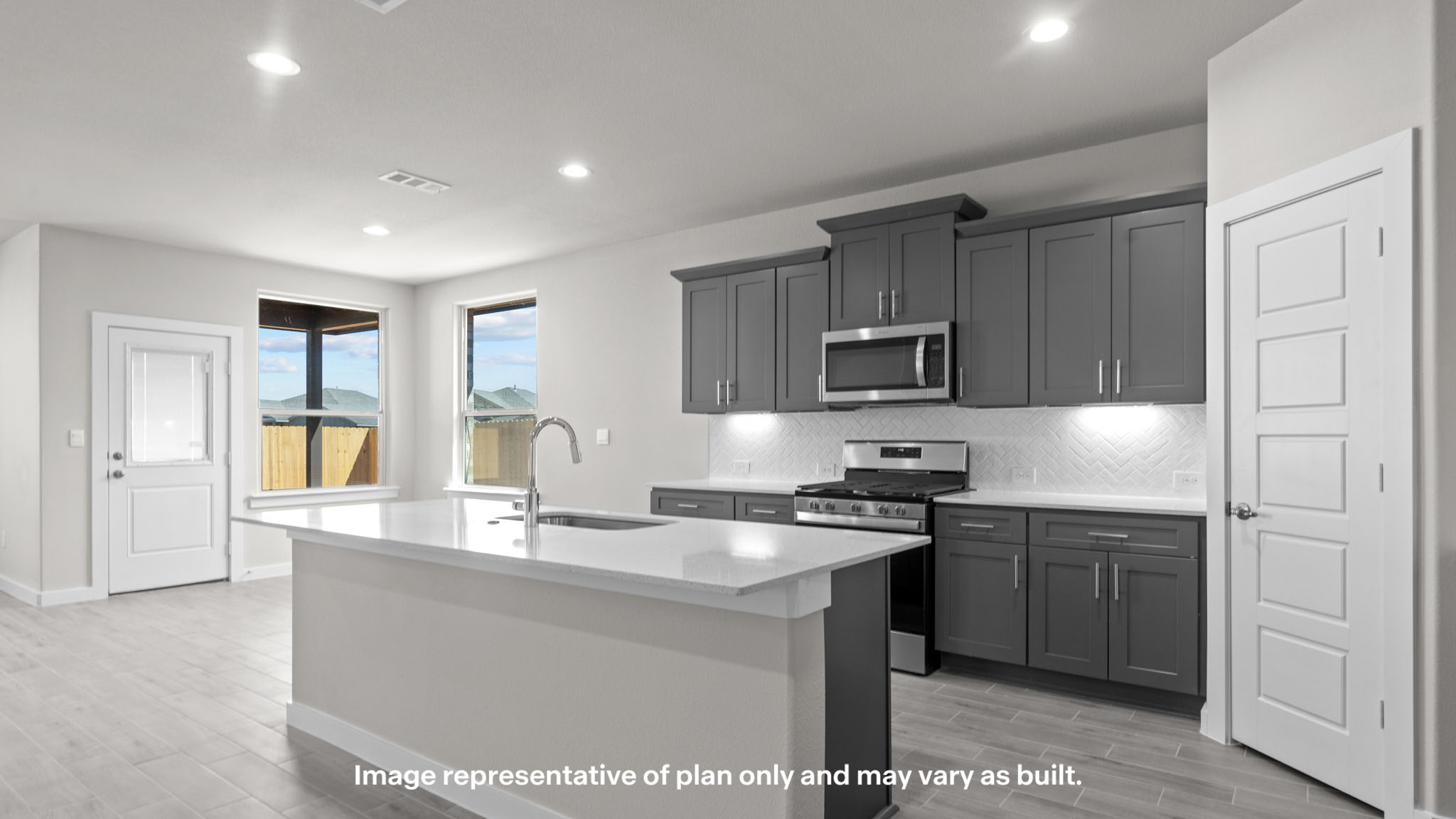 Spacious open concept kitchen with island and counter prep space