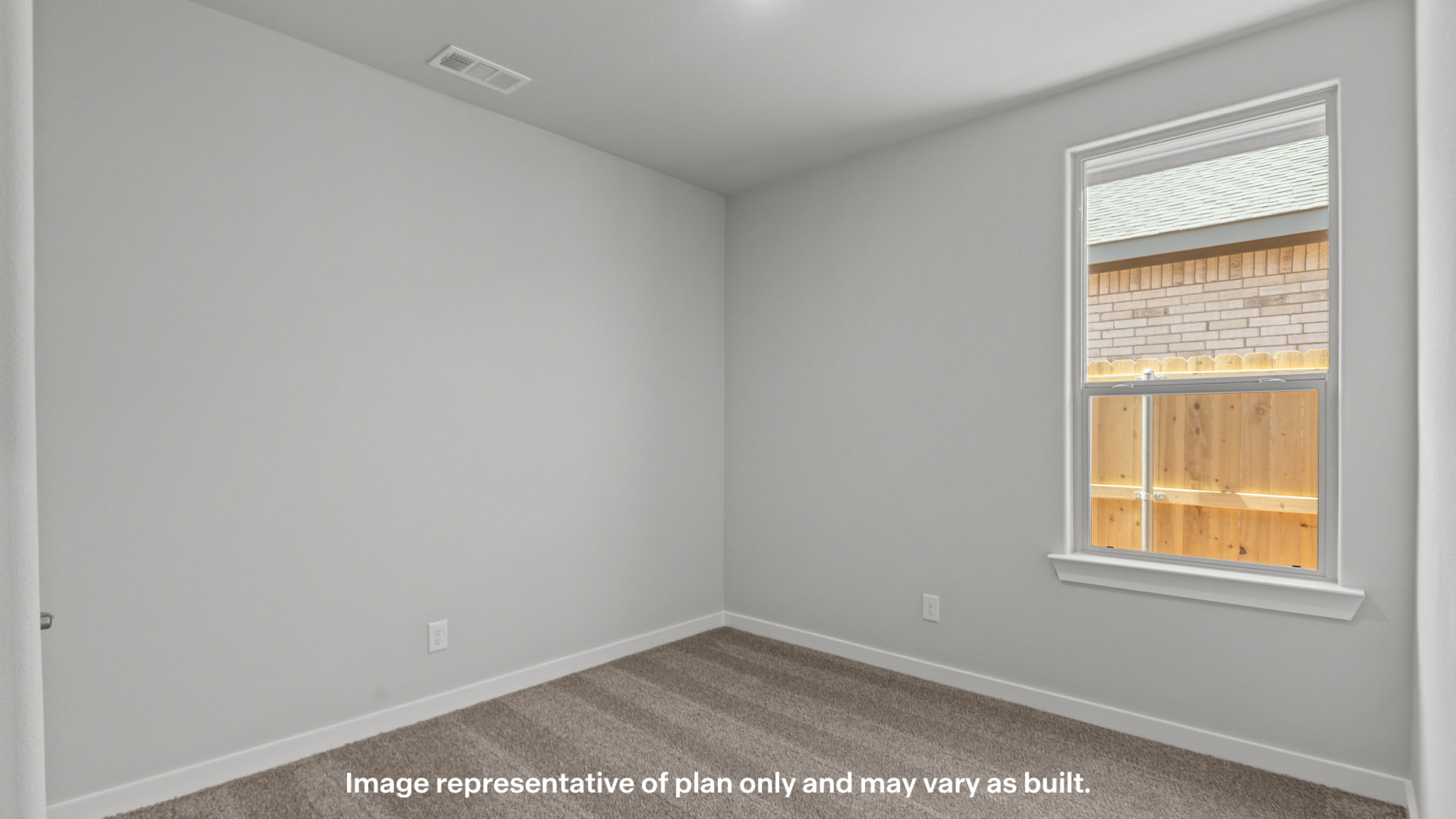 Guest bedroom 2 with side window and plush carpet floor