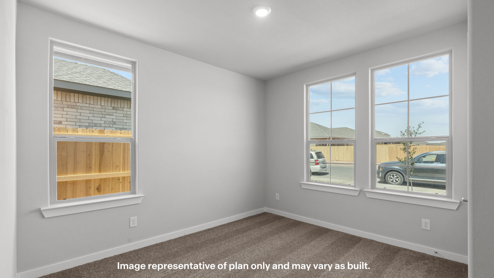 Guest bedroom 1 with front windows and ample natural light