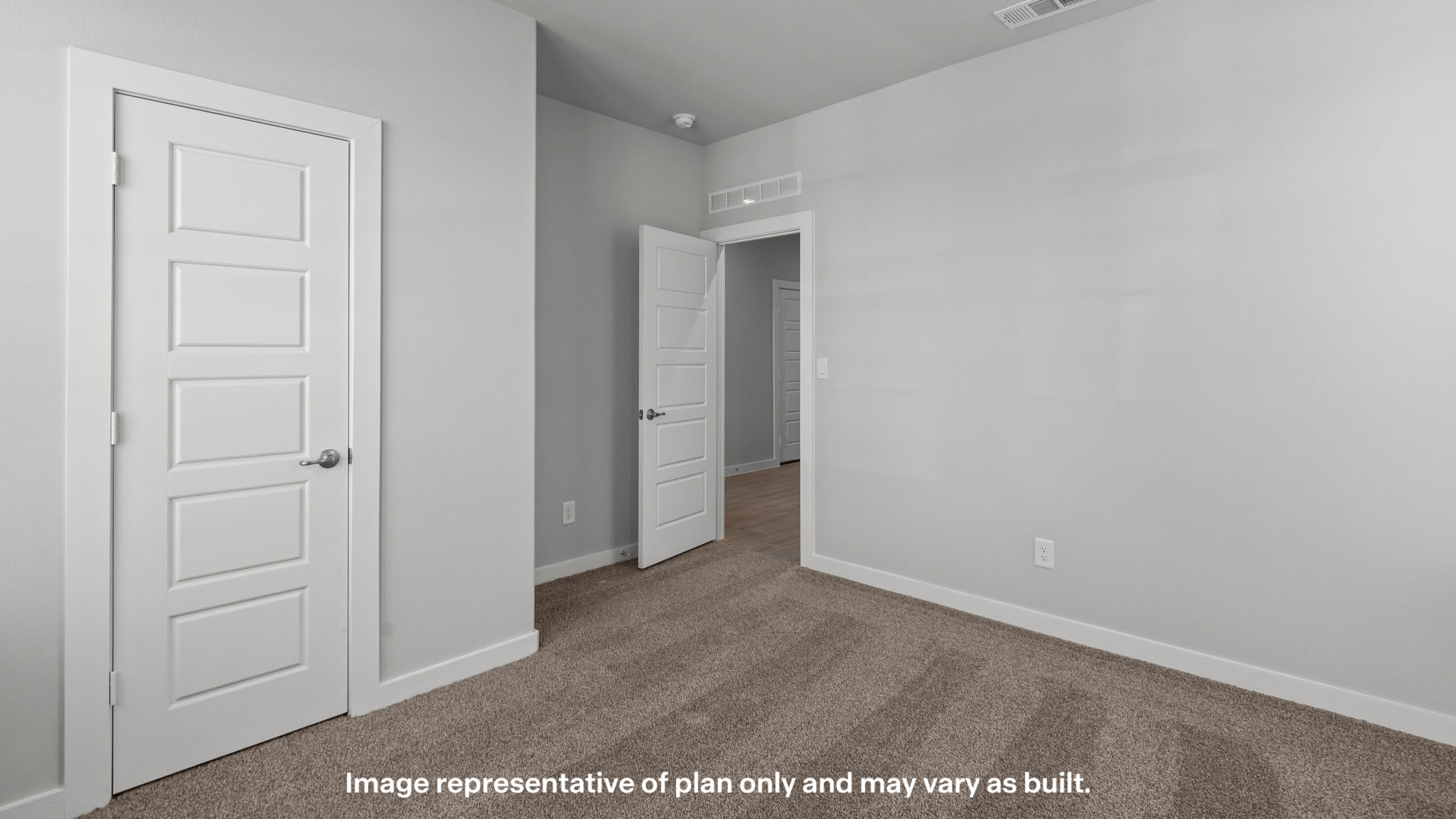 Guest bedroom 1 with front windows and ample natural light