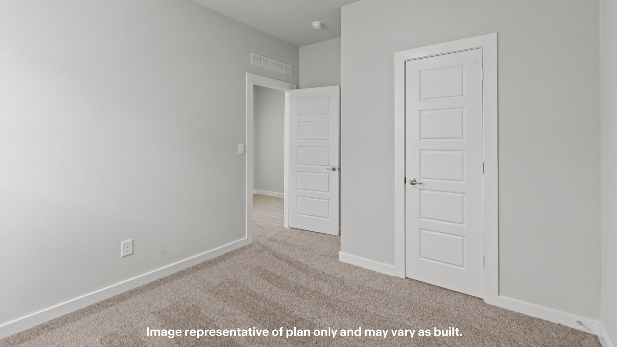 Guest bedroom 2 with side window and plush carpet floor