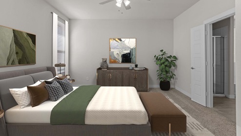Primary bedroom with private attached bathroom decorated with warm neautral tones