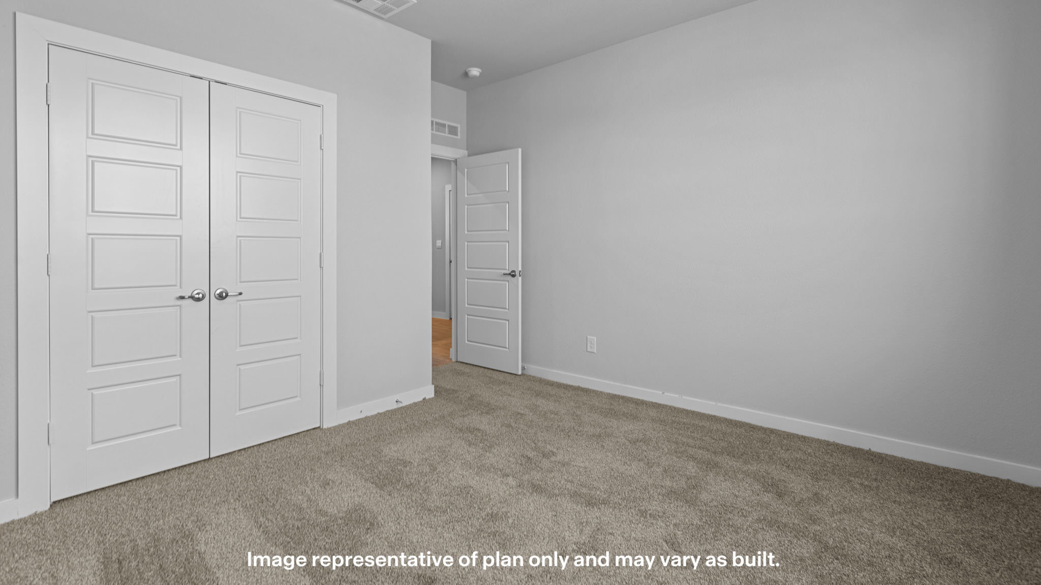 Guest bedroom 1 with front windows and ample natural light