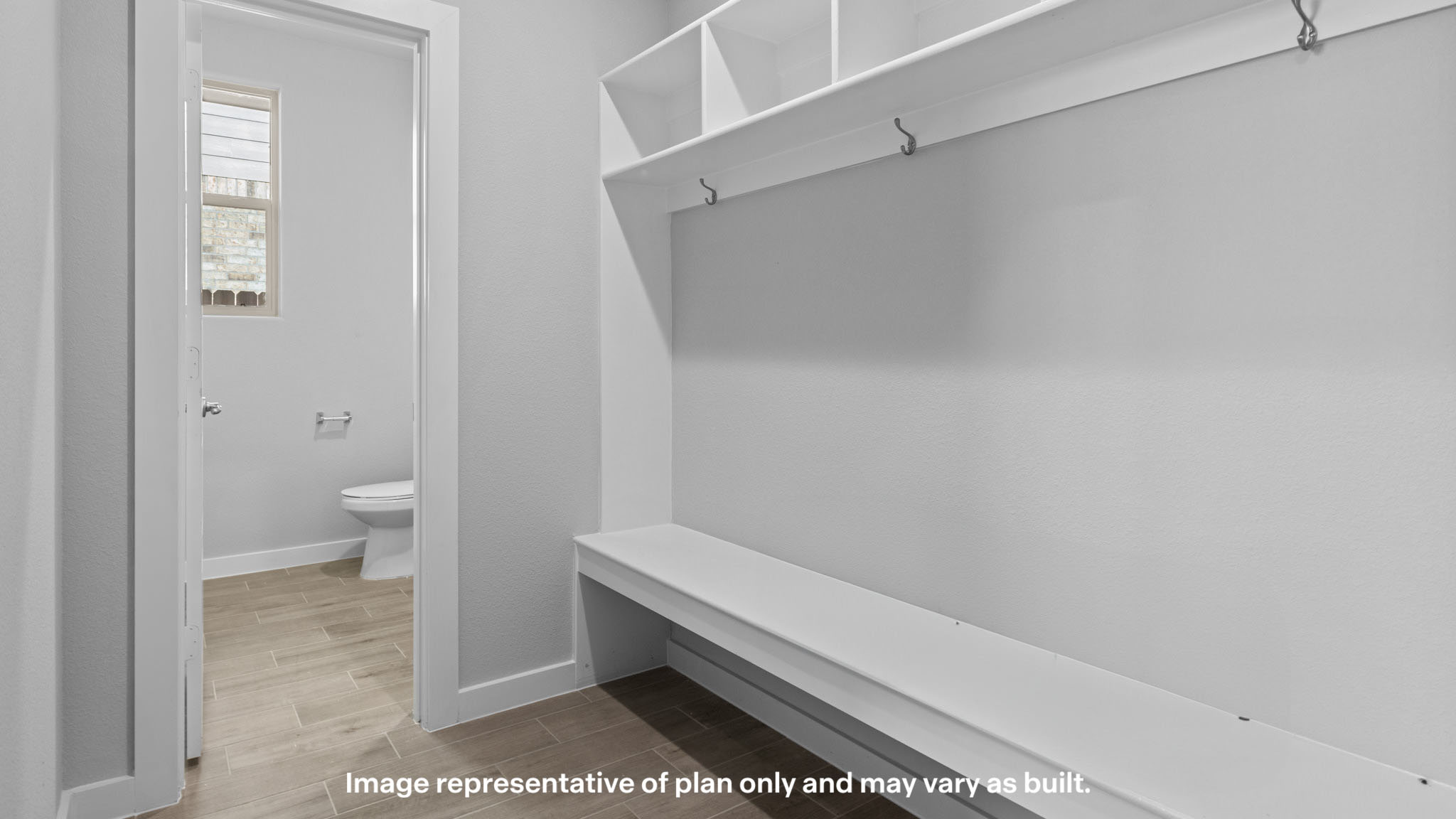 Foyer with mudroom space and additional storage