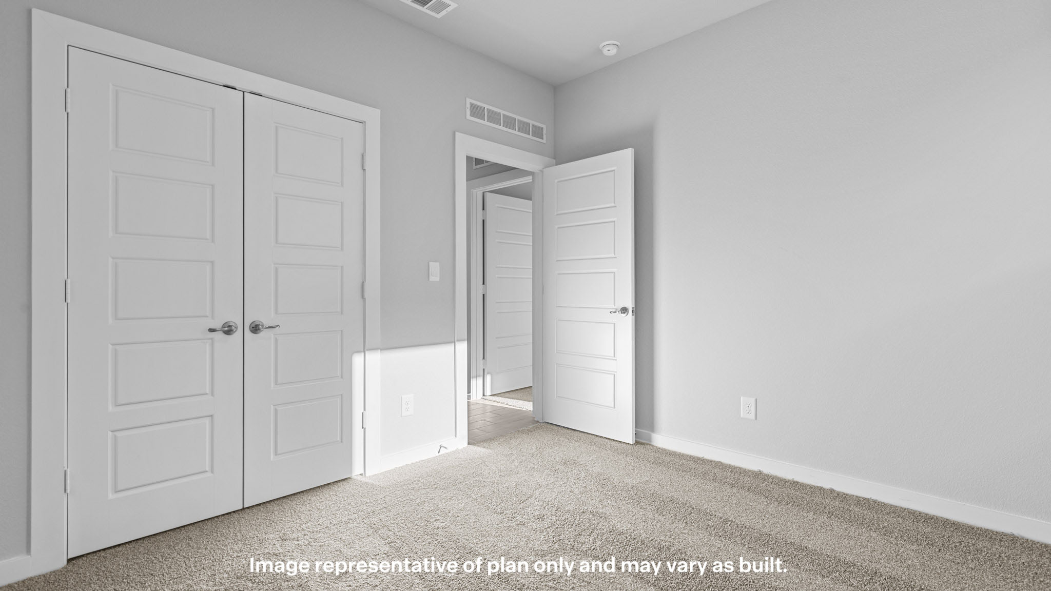 Guest bedroom 3 with plush carpet floors and spacious closet