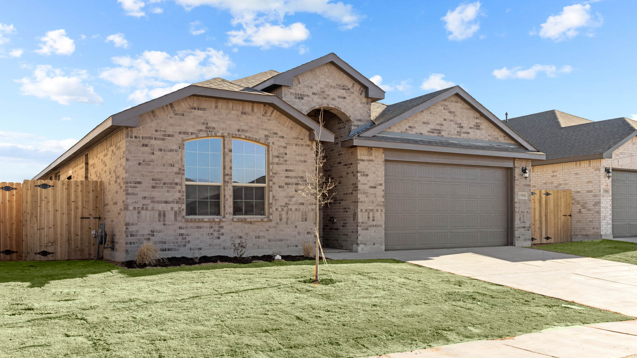 Side view of single story timeless brick home