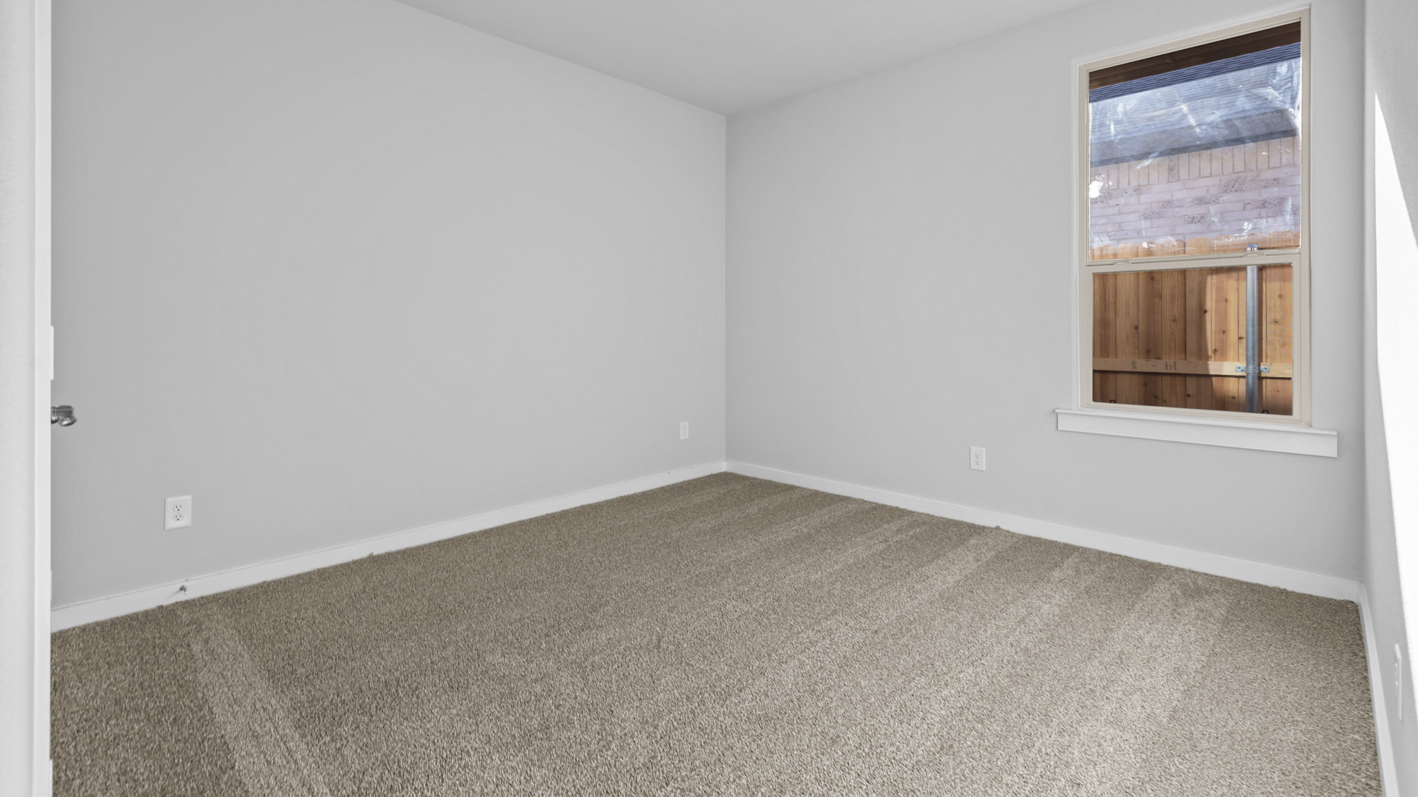 Guest bedroom 3 with plush carpet floors and spacious closet