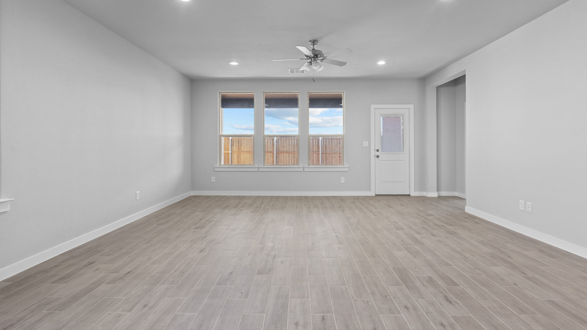 Open living and family room area with ample natural light