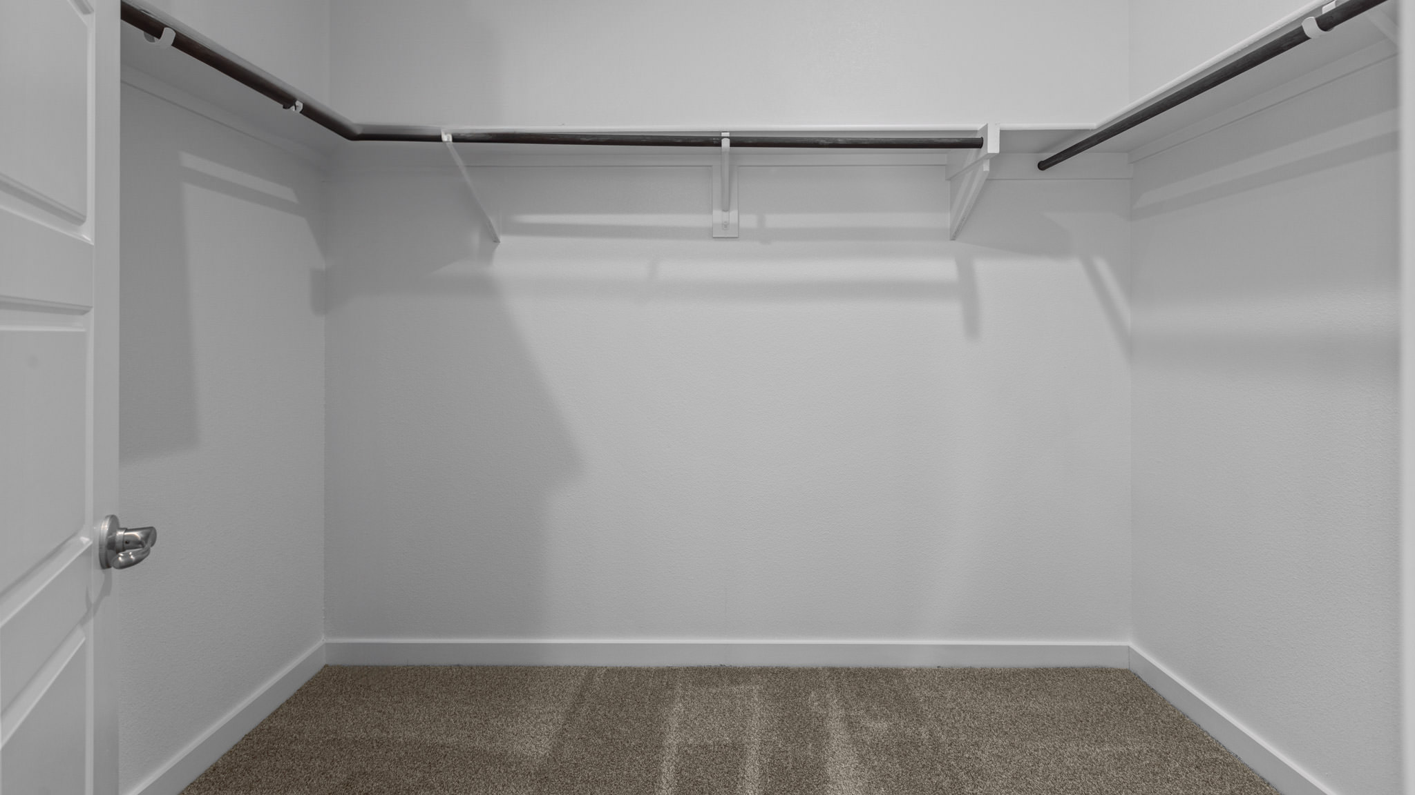 Primary walk-in closet with extra storage space