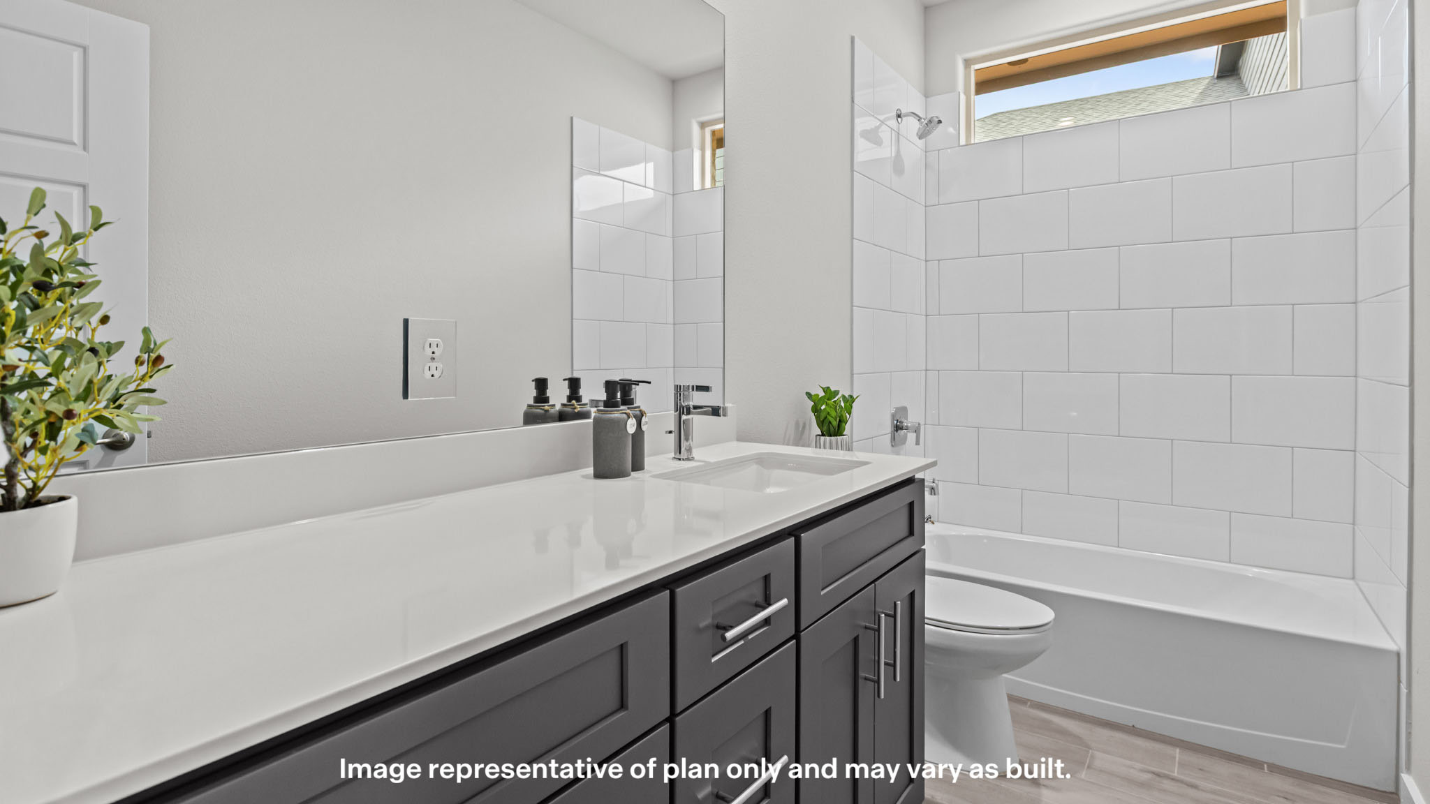 Guest bathroom with built in vanity and combination bathtub shower