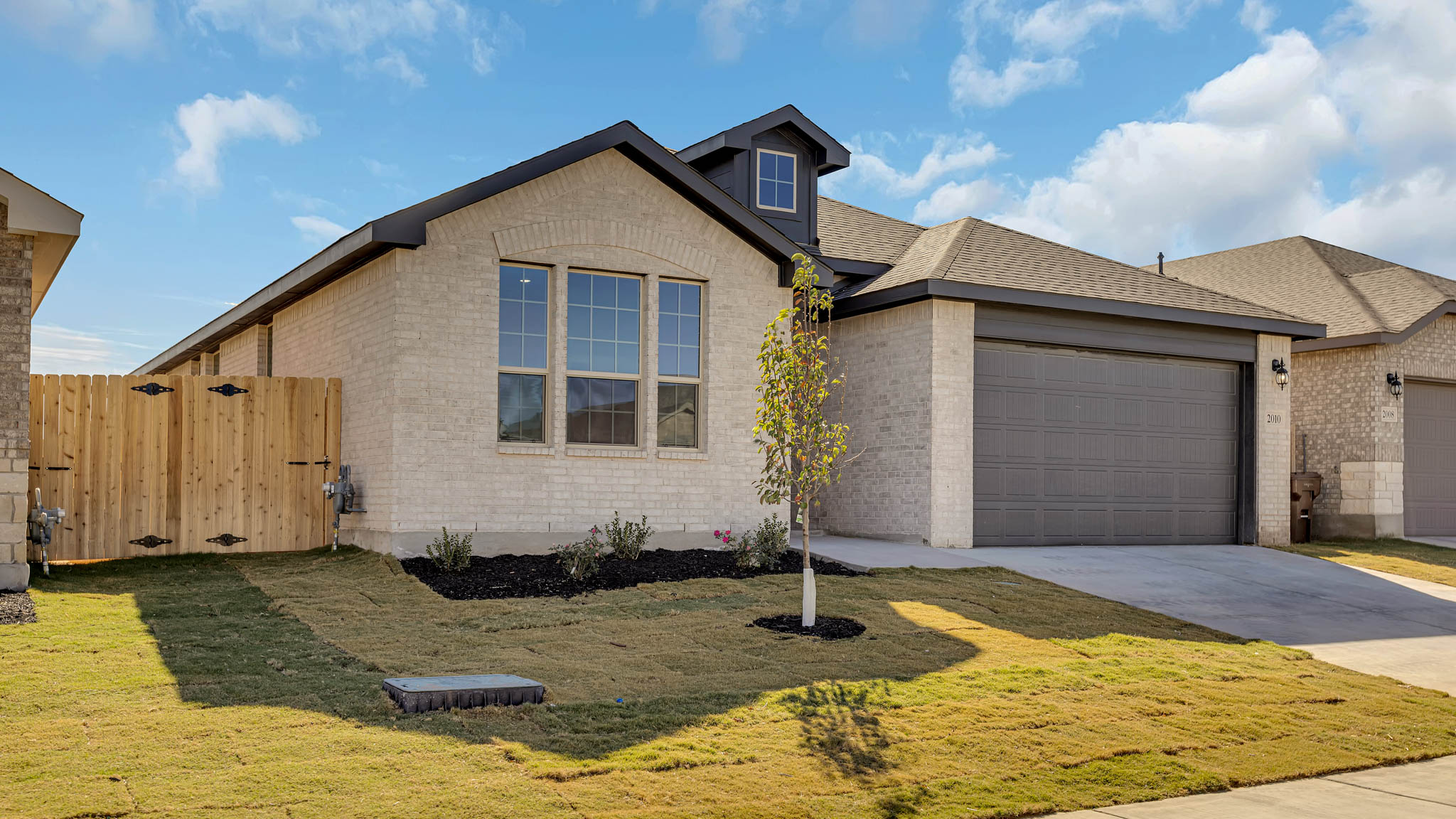 Single story classic brick home with front entry
