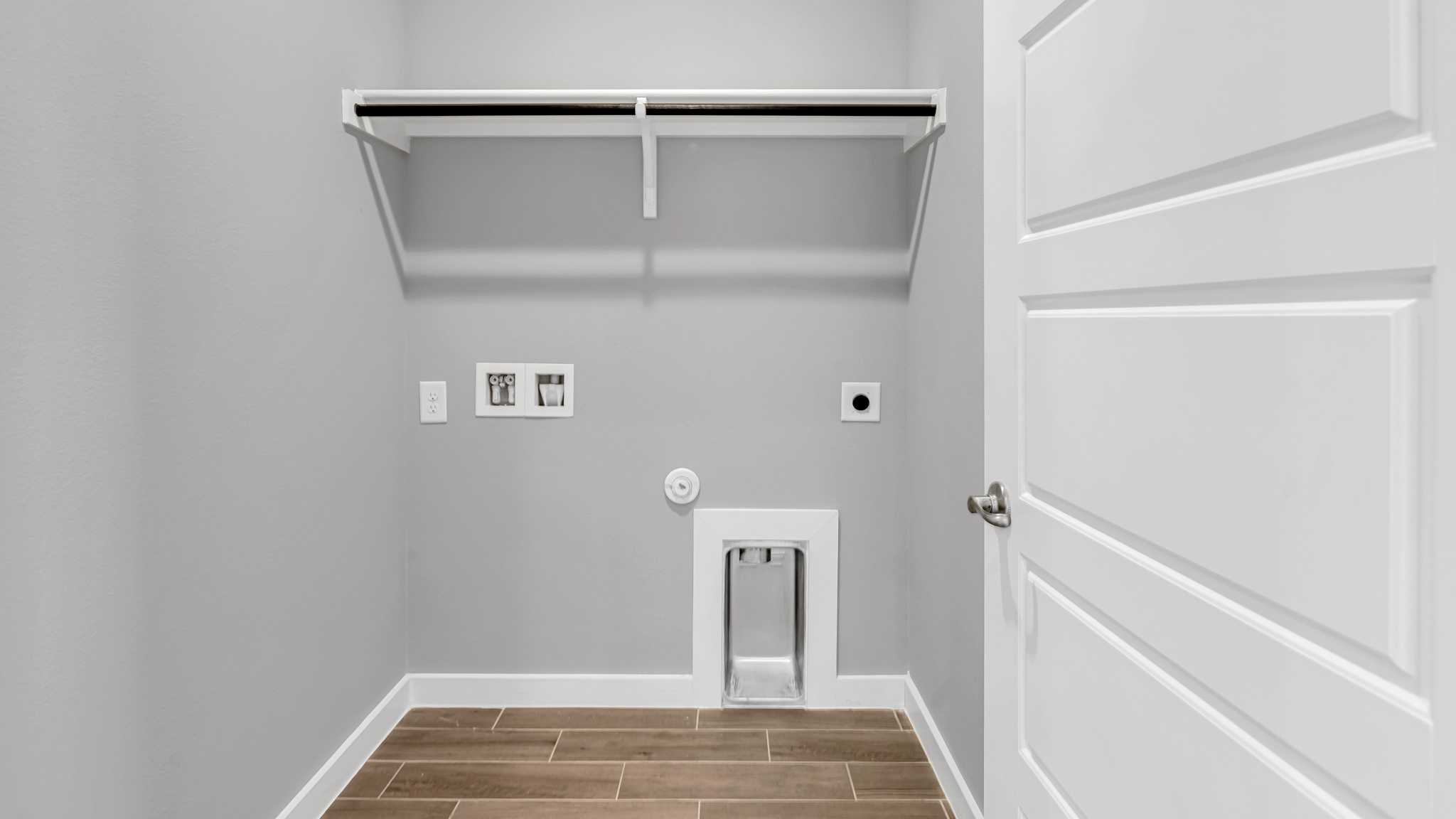 Laundry room and utility closet space with extra storage