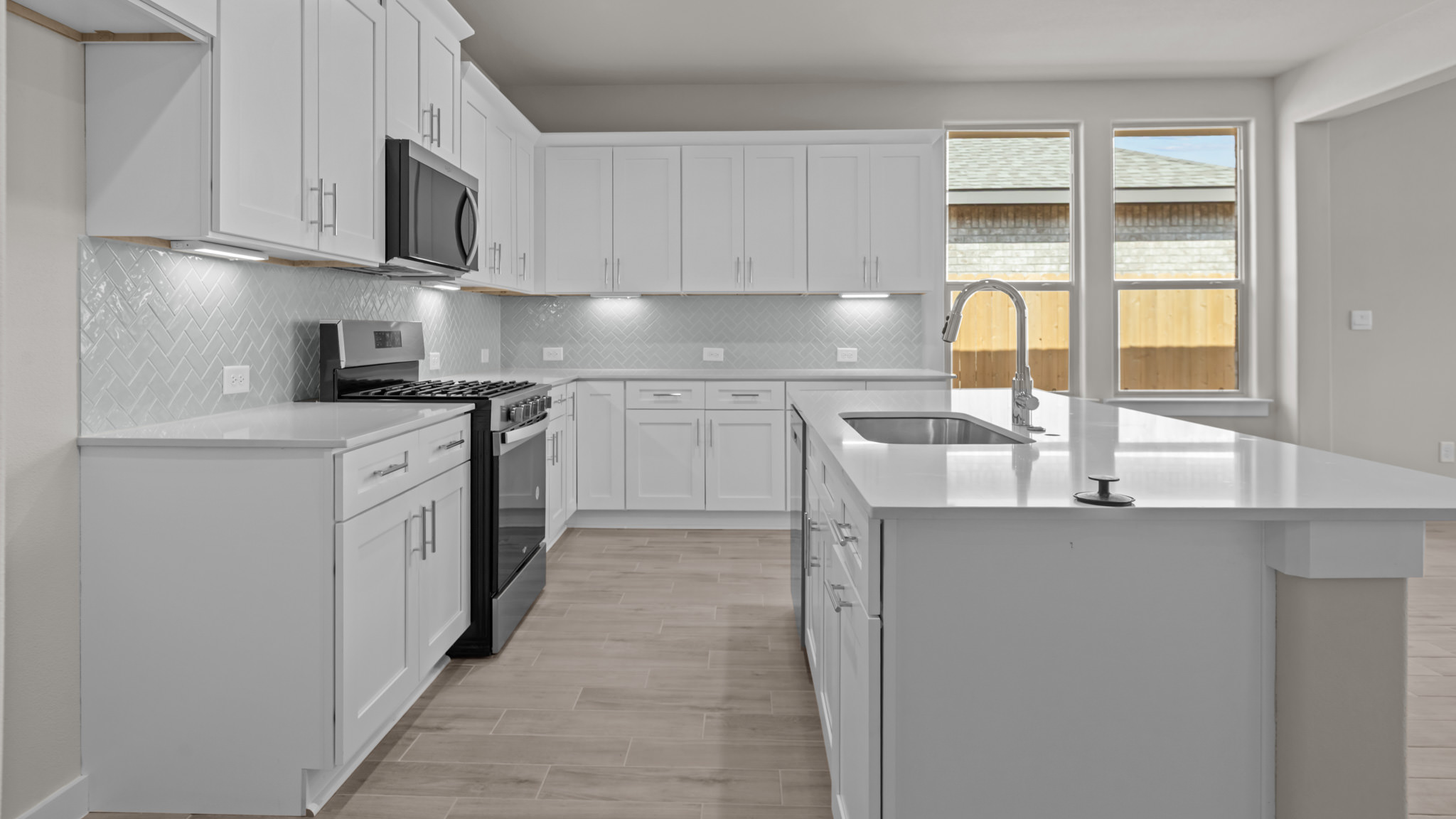 Spacious open concept kitchen with island and counter prep space