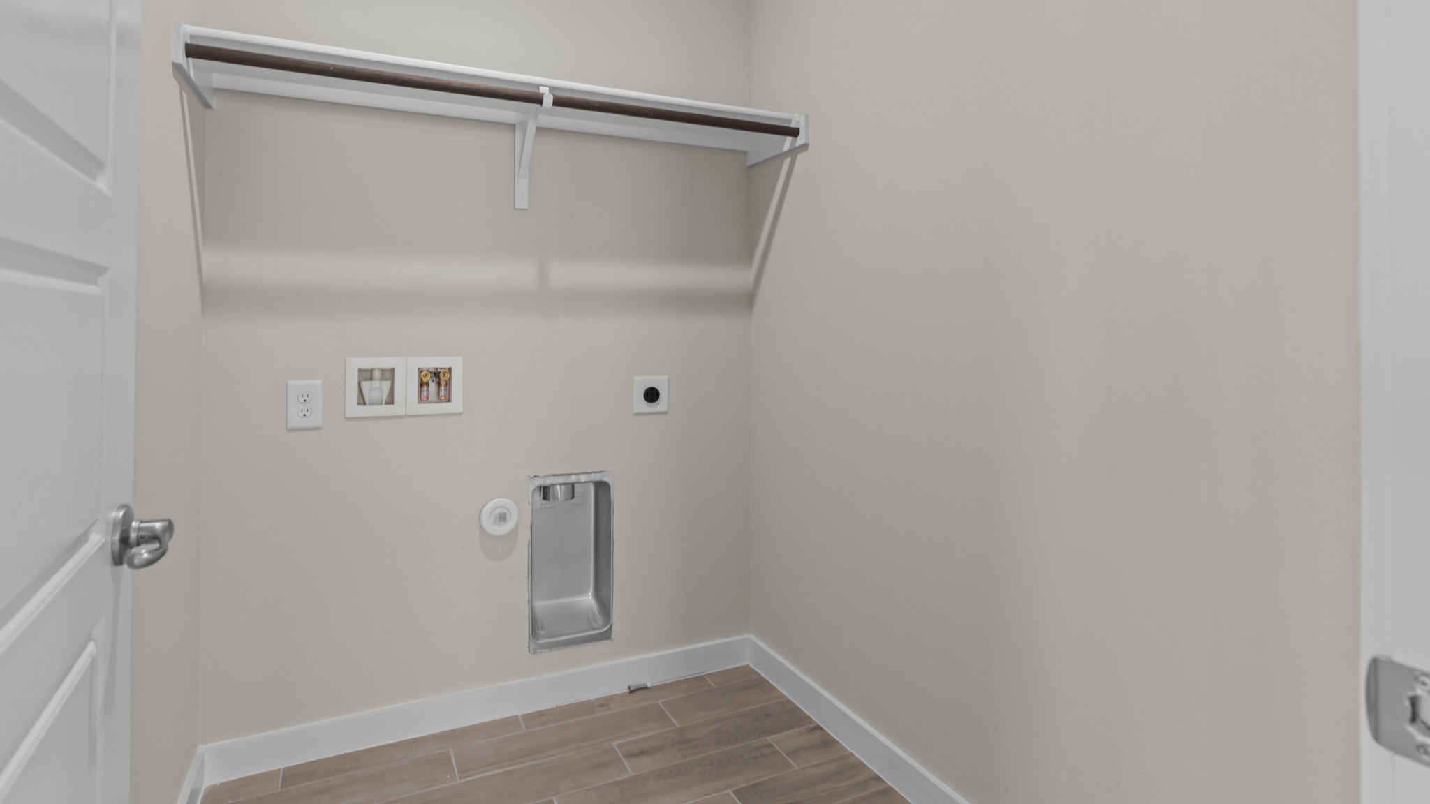 Laundry room and utility closet space with extra storage