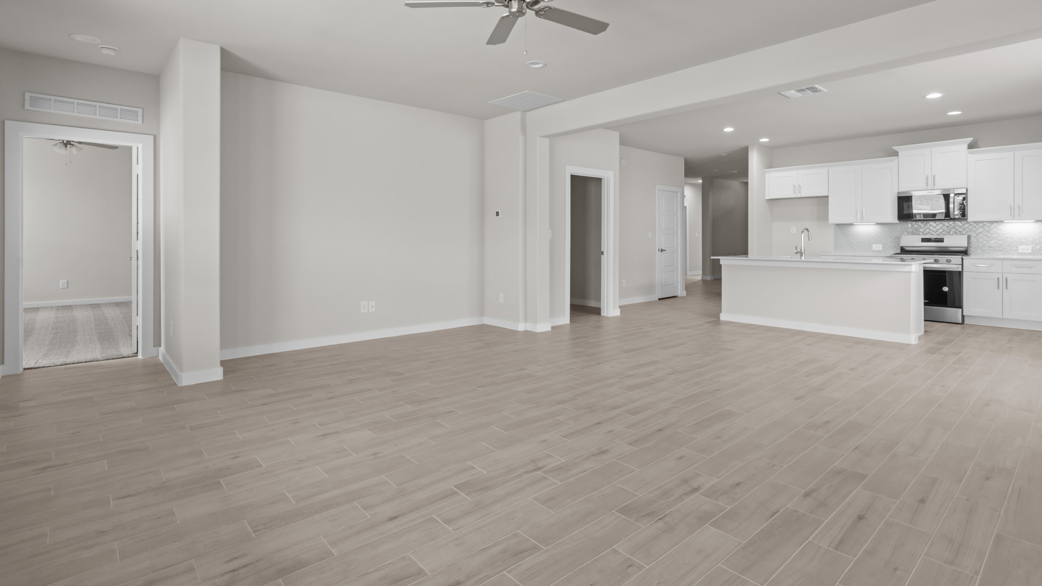 Open concept kitchen, living, family, and dining room space