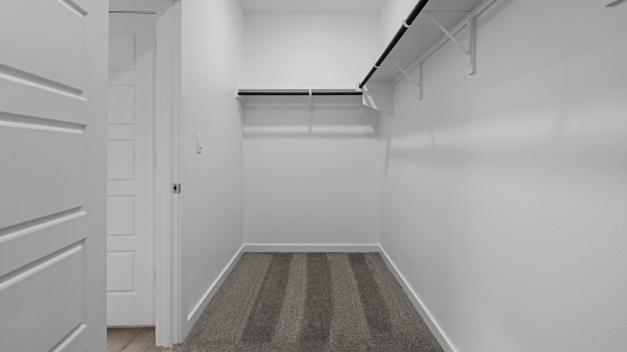 Primary walk-in closet with extra storage space