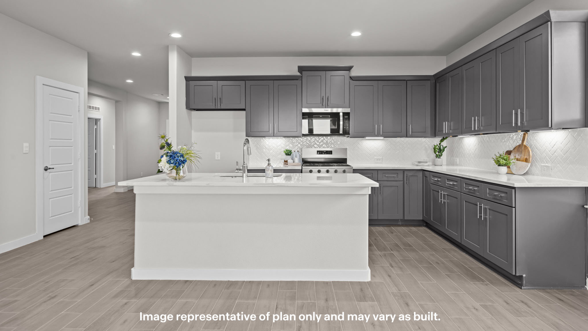 Spacious open concept kitchen with island and counter prep space