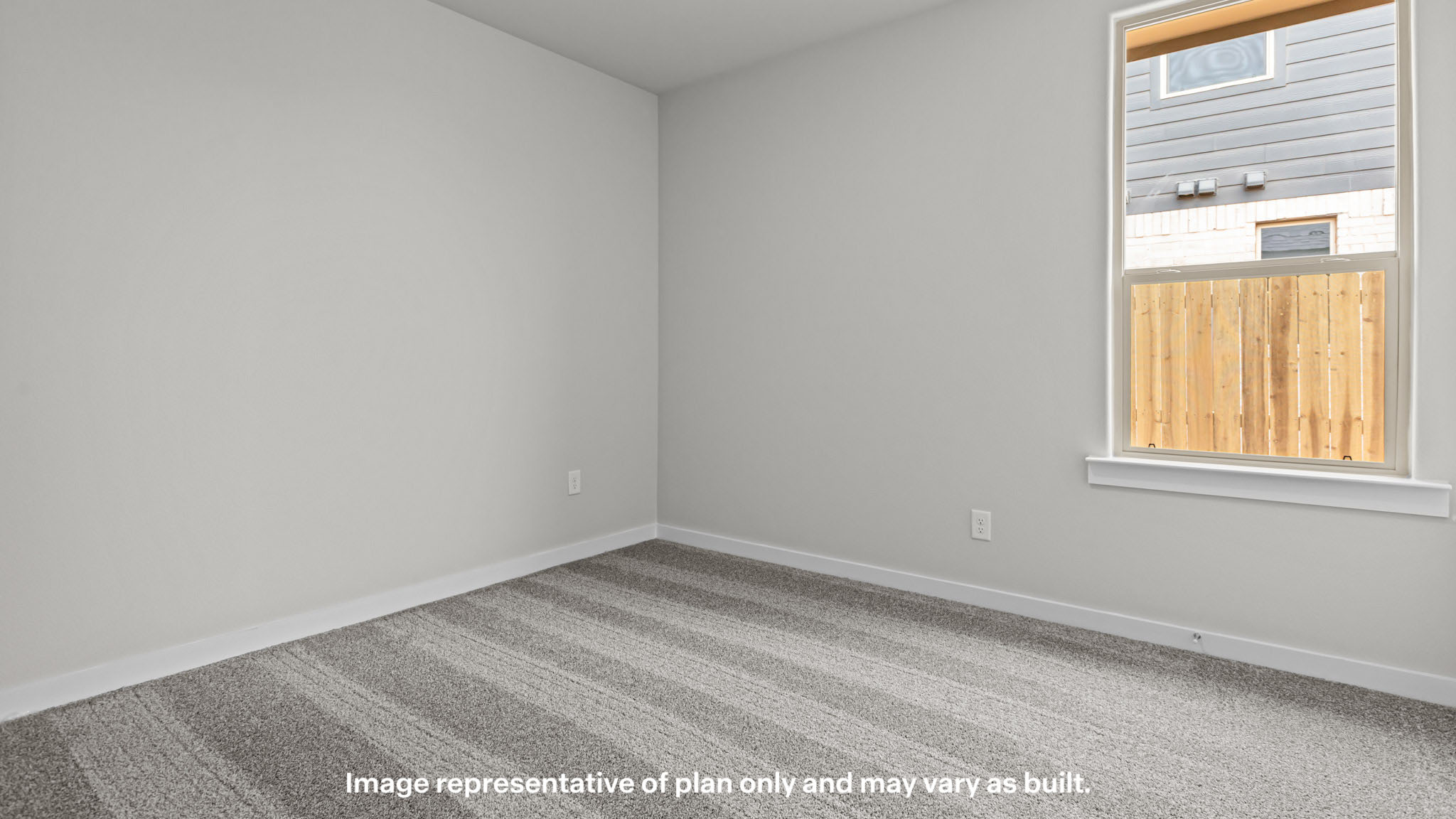 Guest bedroom 2 with side window and plush carpet floor
