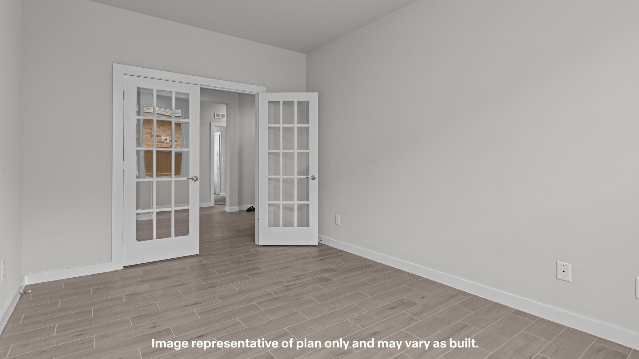 Office or formal dining room space with private French doors