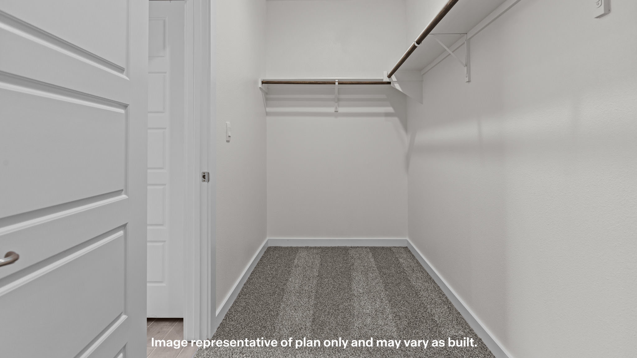 Primary walk-in closet with extra storage space