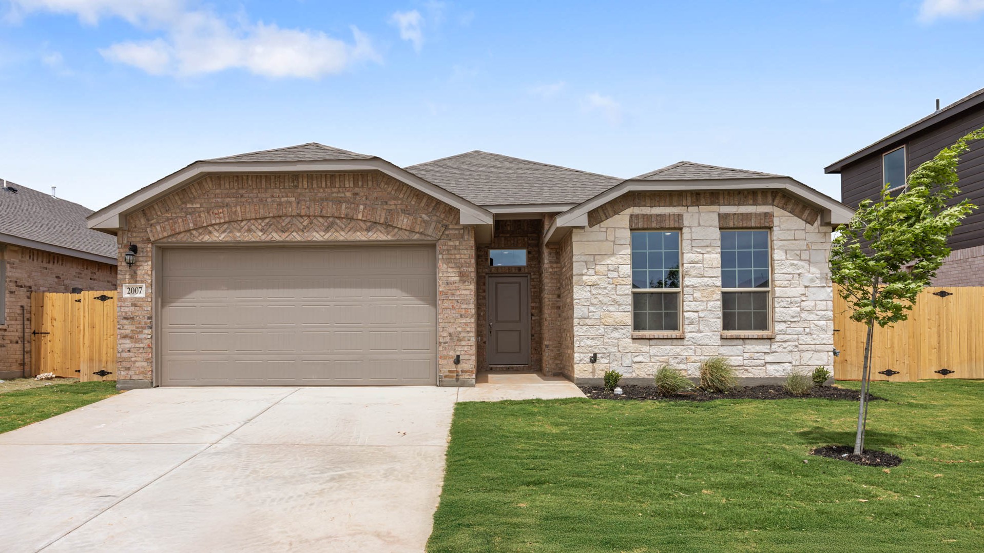 Single story classic brick home with front entry