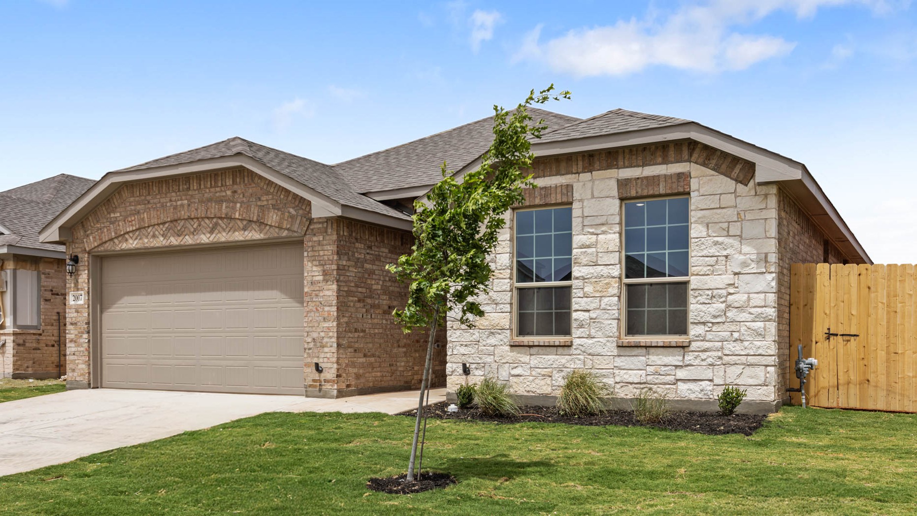 Side view of single story timeless brick home