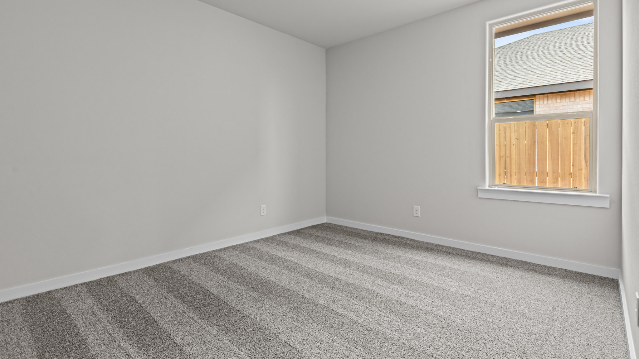 Guest bedroom 3 with plush carpet floors and spacious closet