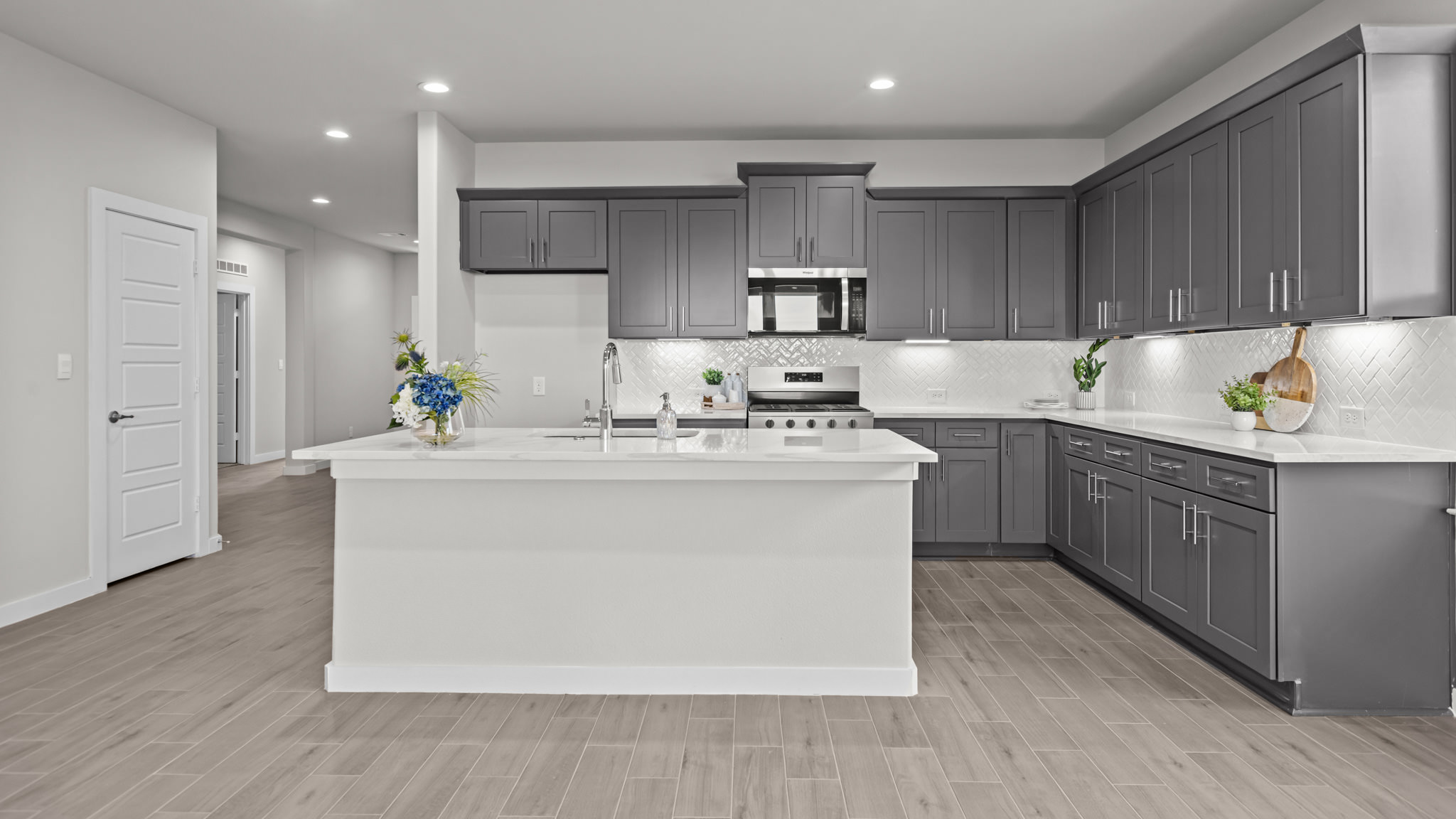 Spacious open concept kitchen with island and counter prep space