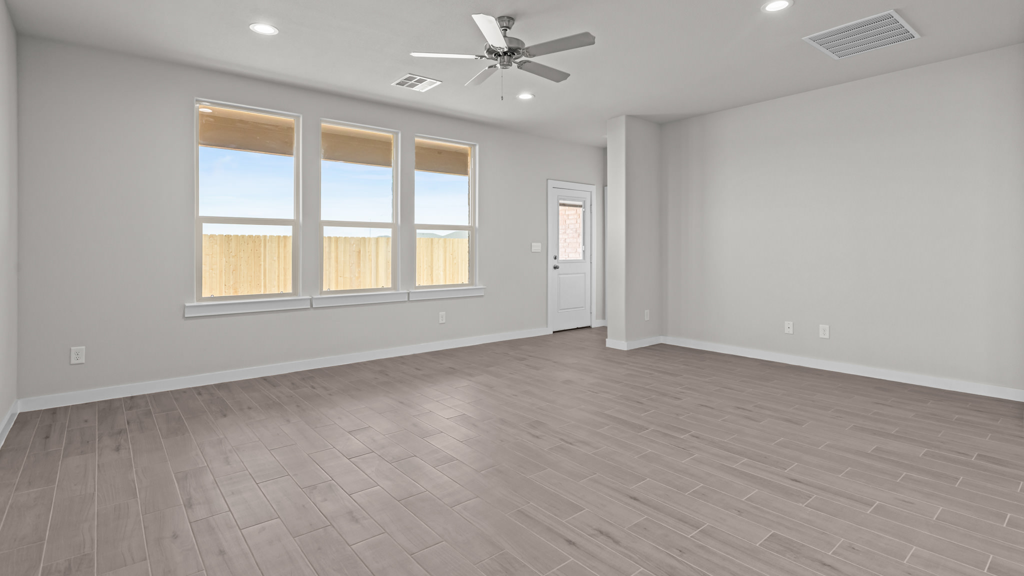 Open living and family room area with ample natural light