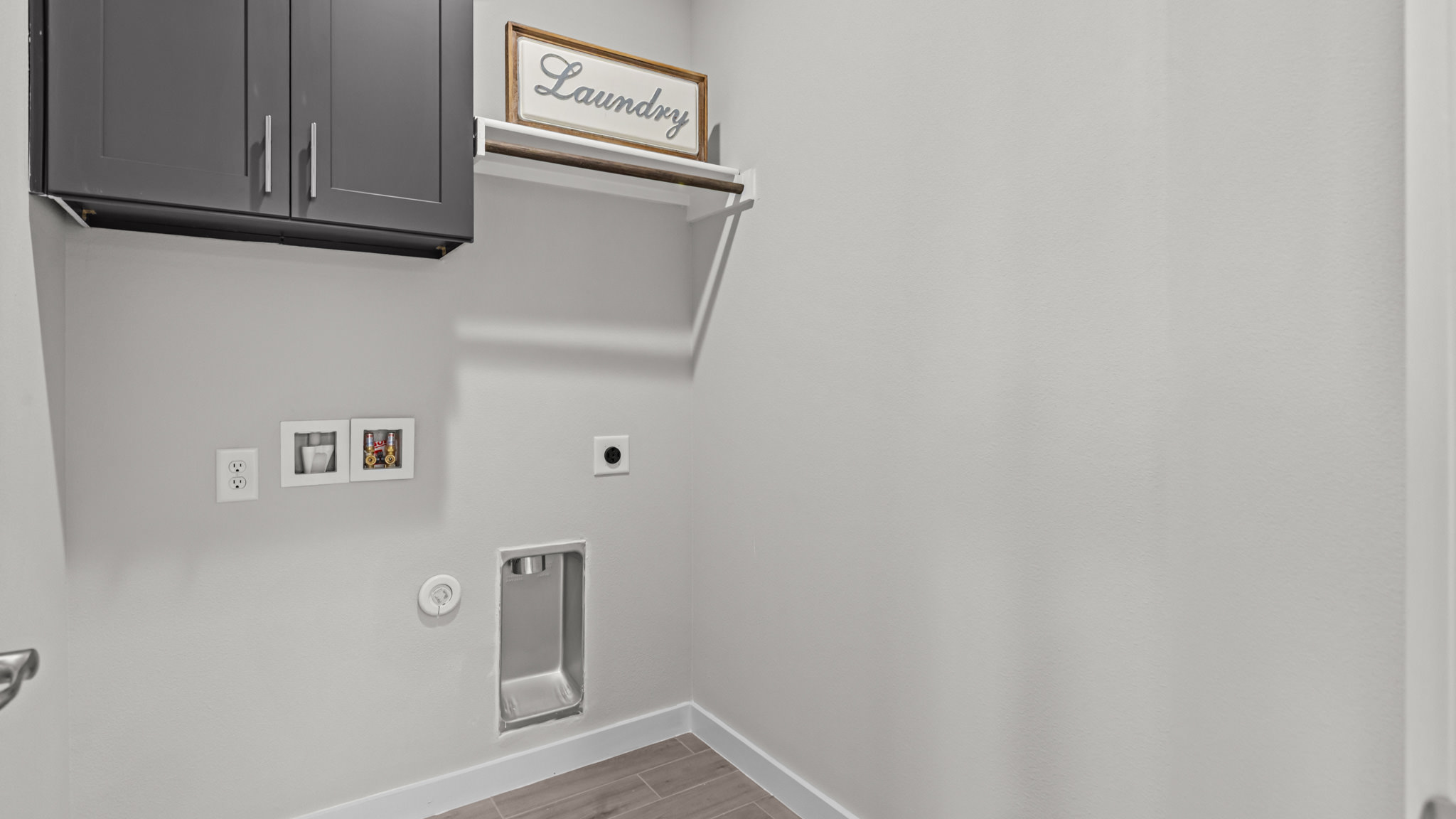 Laundry room and utility closet space with extra storage