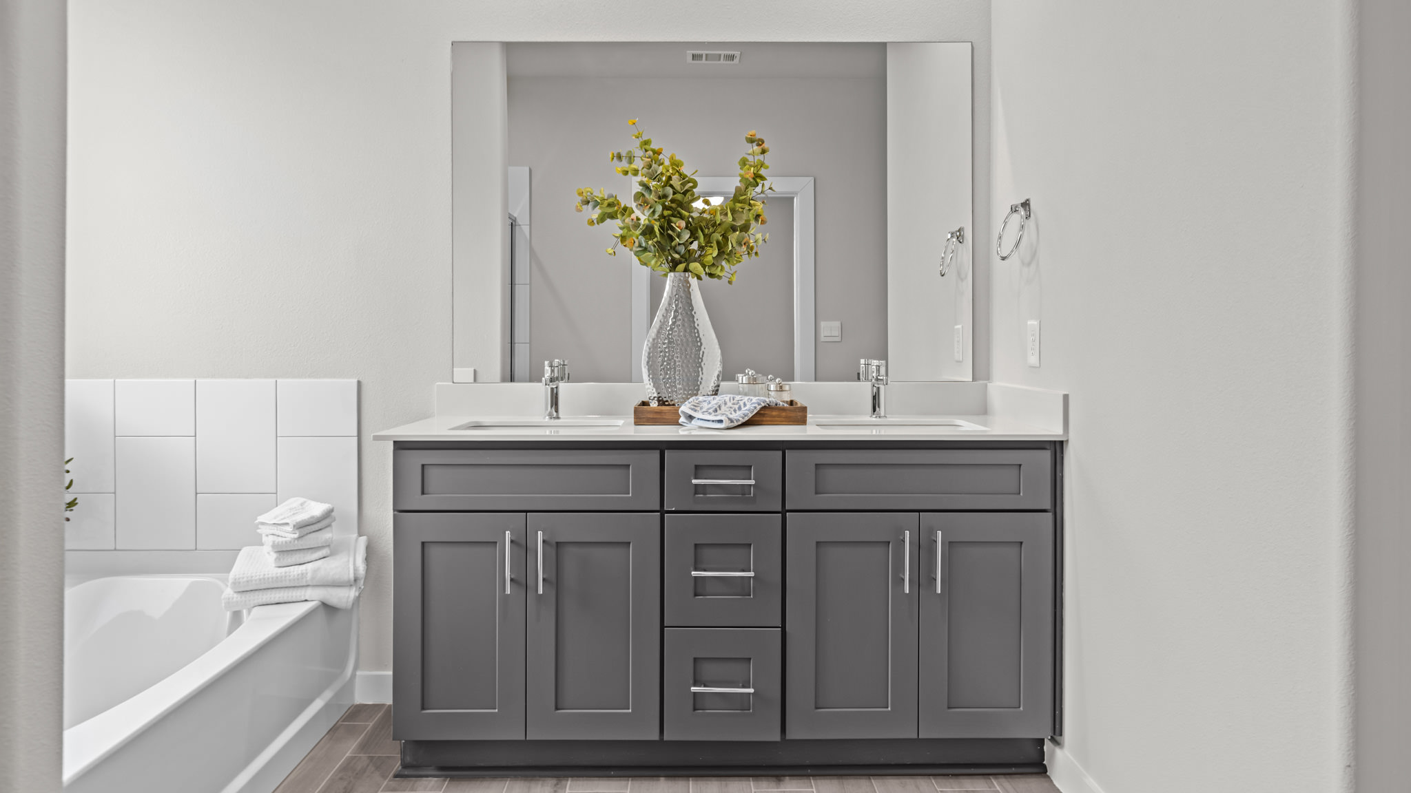 Primary bathroom with built in vanity and luxurious shower