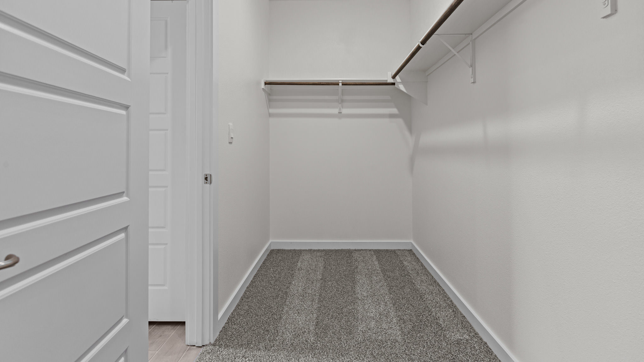 Primary walk-in closet with extra storage space