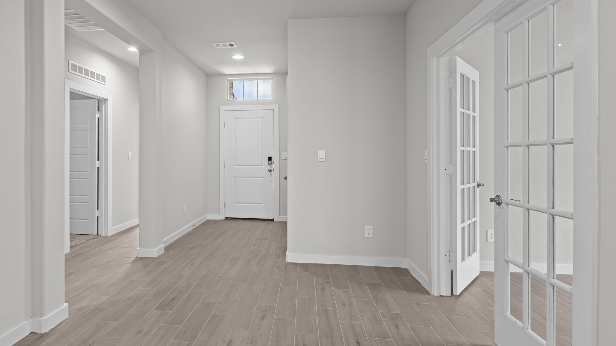 Spacious foyer with study and guest bedrooms on opposite sides