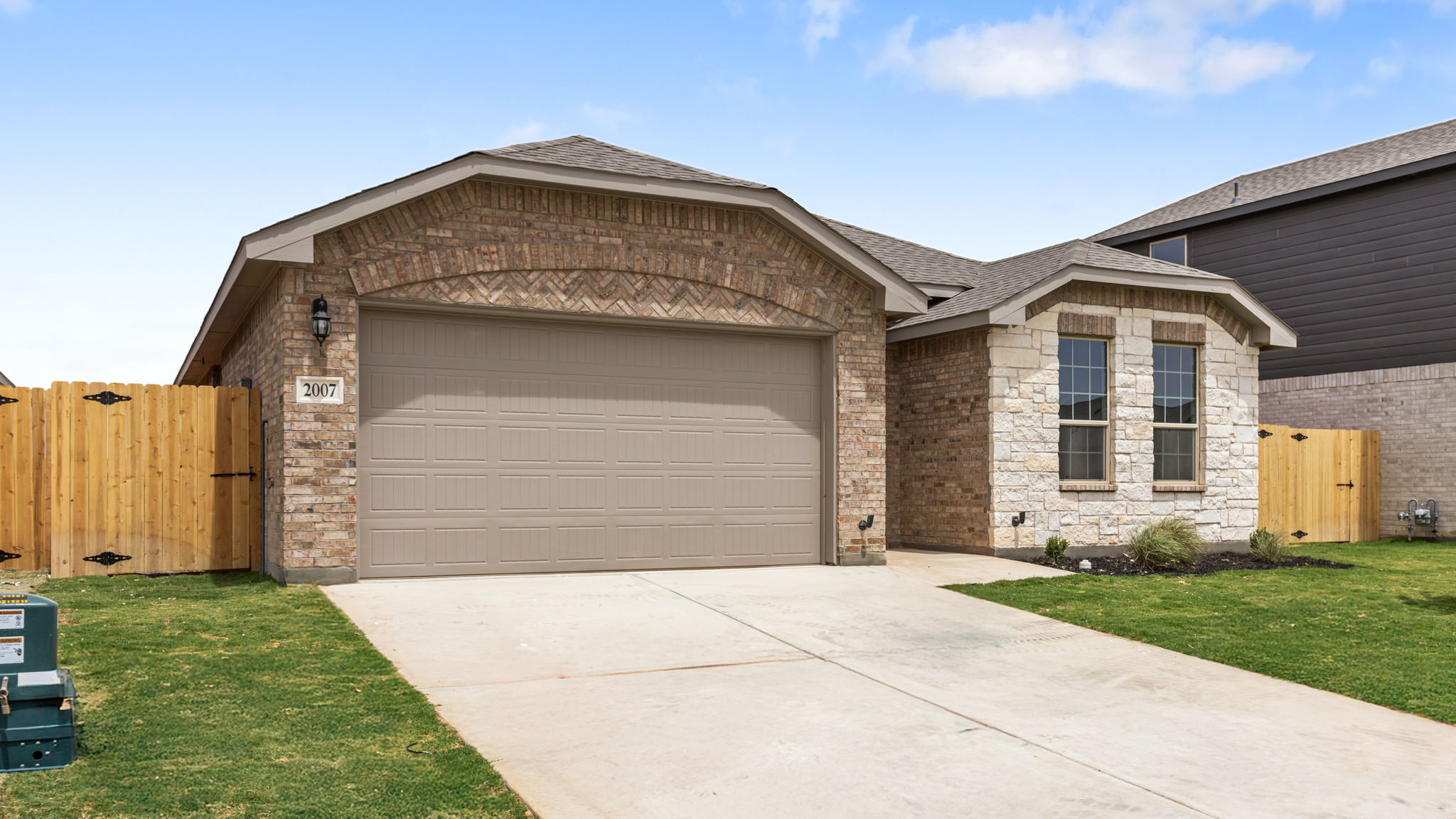 Exterior of single story modern brick style home
