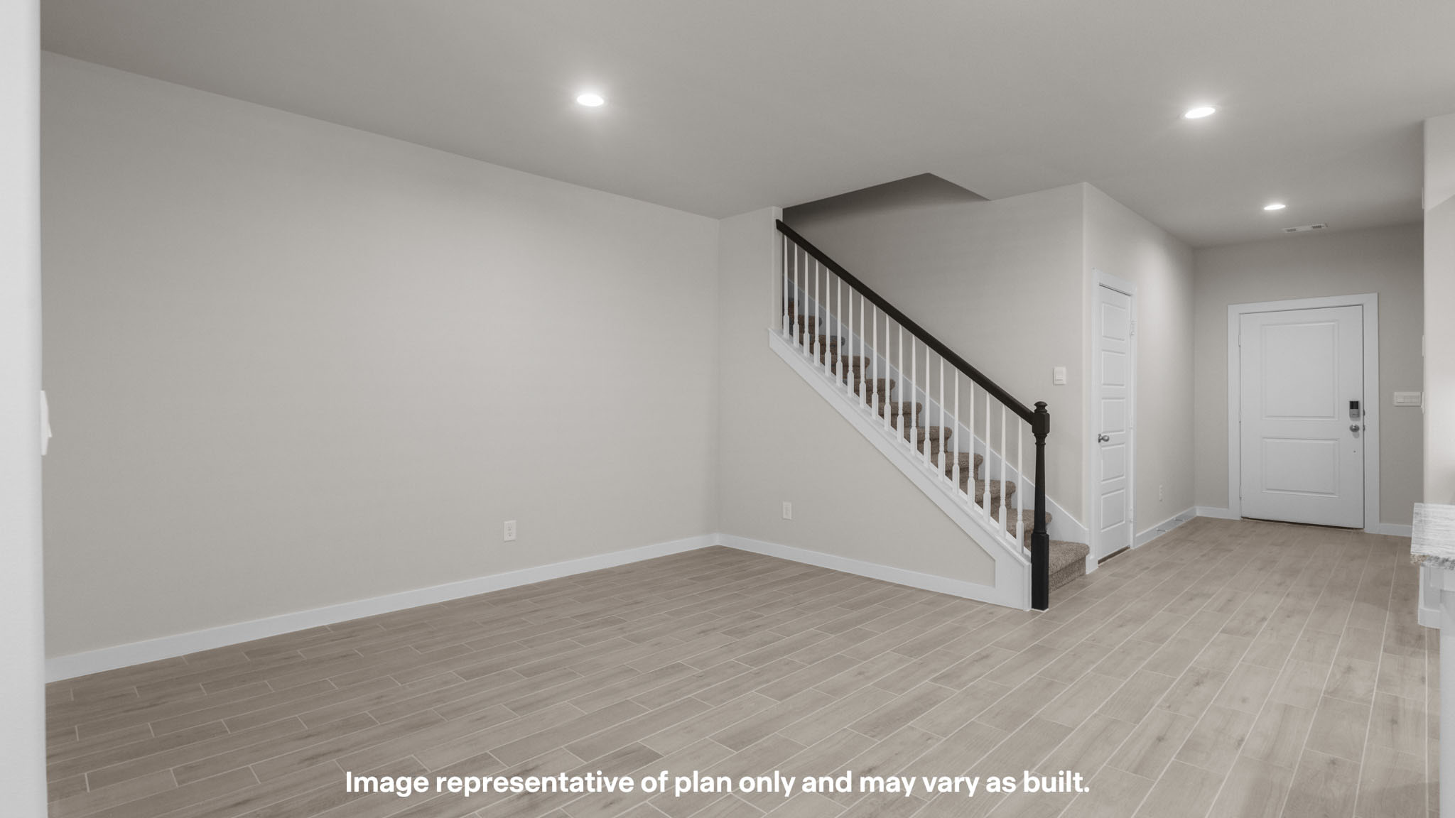 Spacious living and family room space with light allowing windows