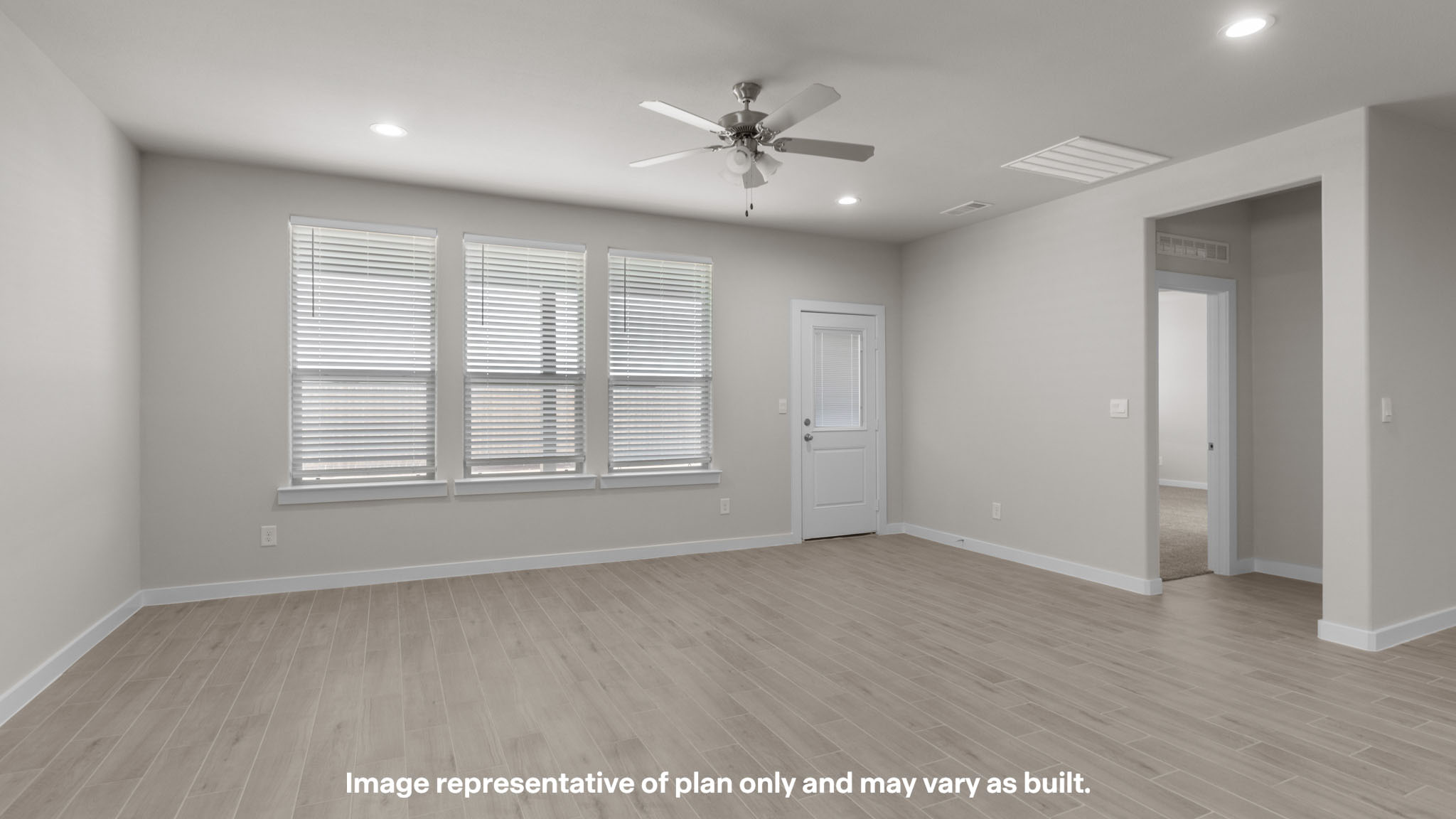 Spacious living and family room space with light allowing windows