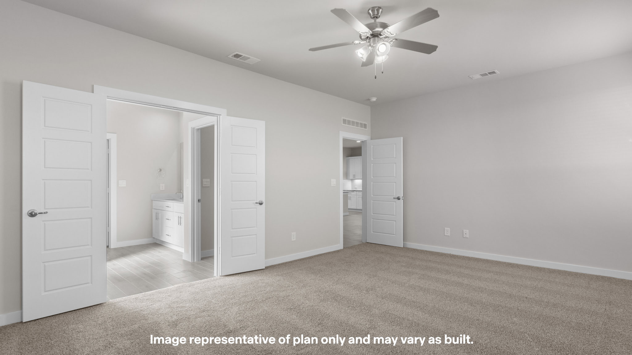 Primary bedroom with private attached bathroom and walk-in closet